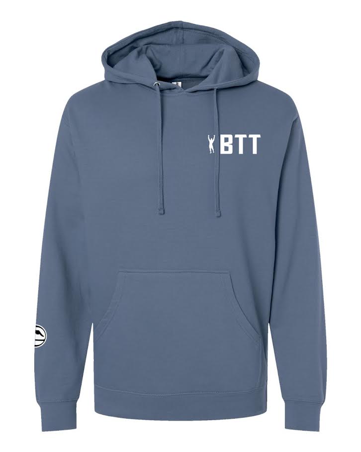 BTT Essential Hoodie Storm Blue in a hooded sweatshirt style with a kangaroo pocket, featuring white text reading BTT and a small figure graphic on the chest.