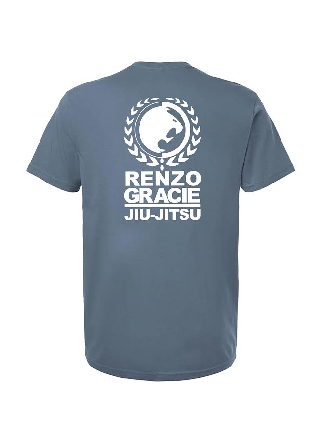 The Renzo Gracie Essential T-Shirt Blue Jean features a white laurel and wave logo above "Renzo Gracie Jiu-Jitsu" text printed on the back.