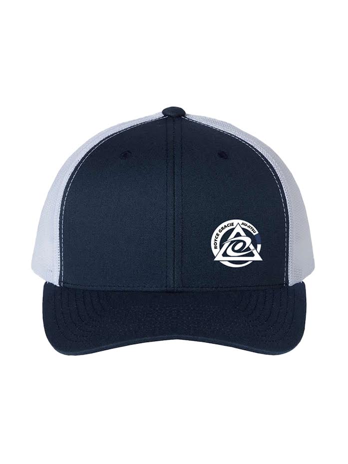 The Royce Gracie Navy Blue Hat is a navy and white trucker cap with a mesh back, featuring an abstract wave logo and the words SOWE GRACE ANGLERS on the front.
