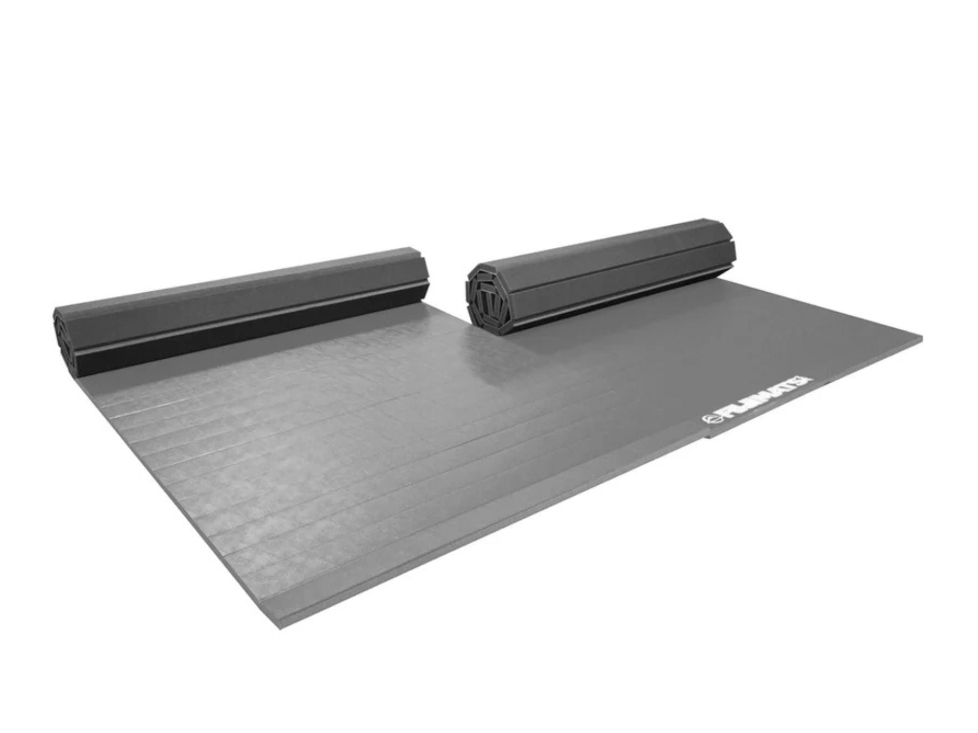 A large grey Home Roll Out Mat Tatami Series, partially unrolled with two rolled sections at the far end and the brand logo visible in one corner.