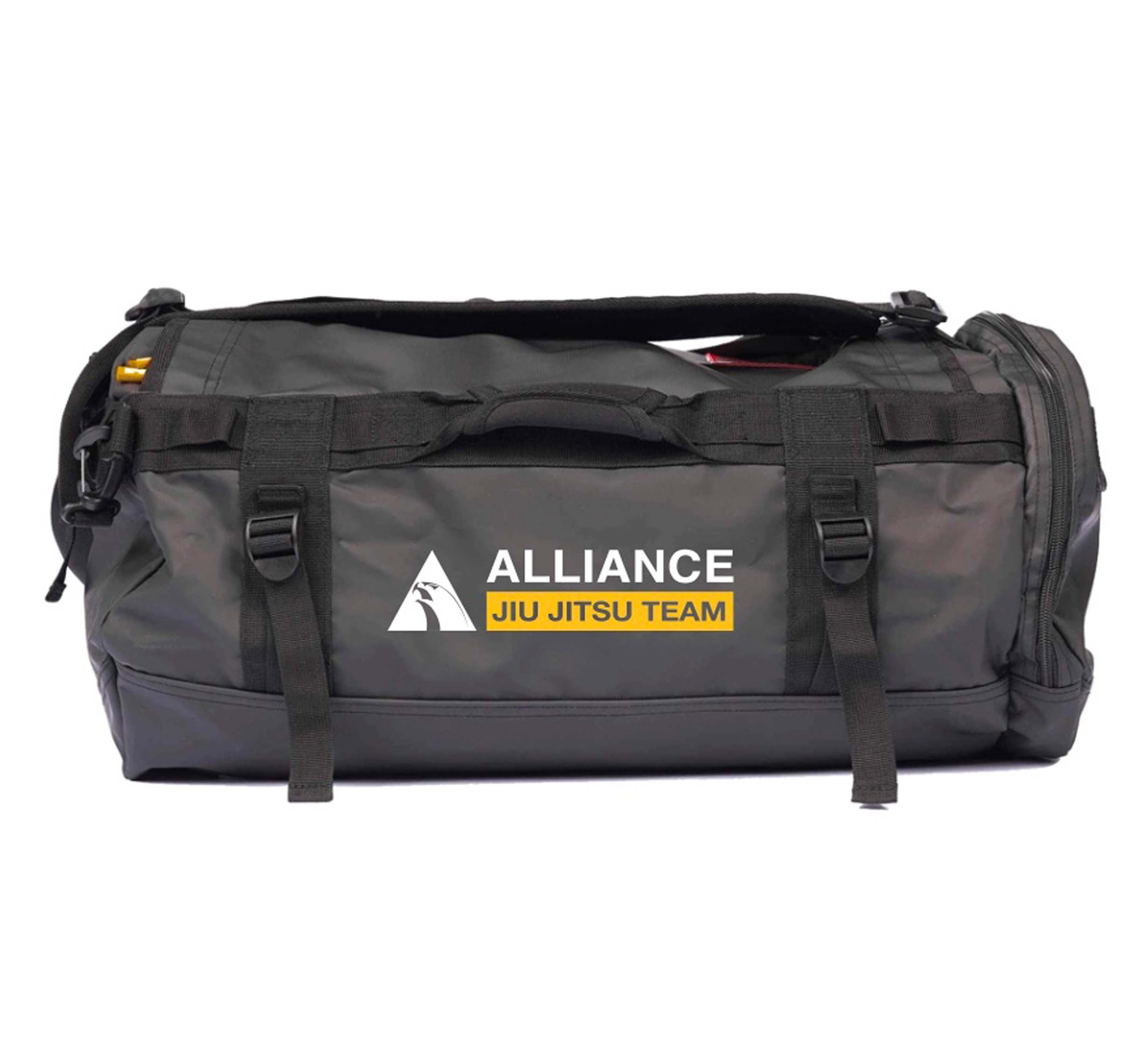 The Alliance Jiu-Jitsu Comp Duffle Black features side straps and displays the ALLIANCE JIU JITSU TEAM logo in white and yellow on the front.