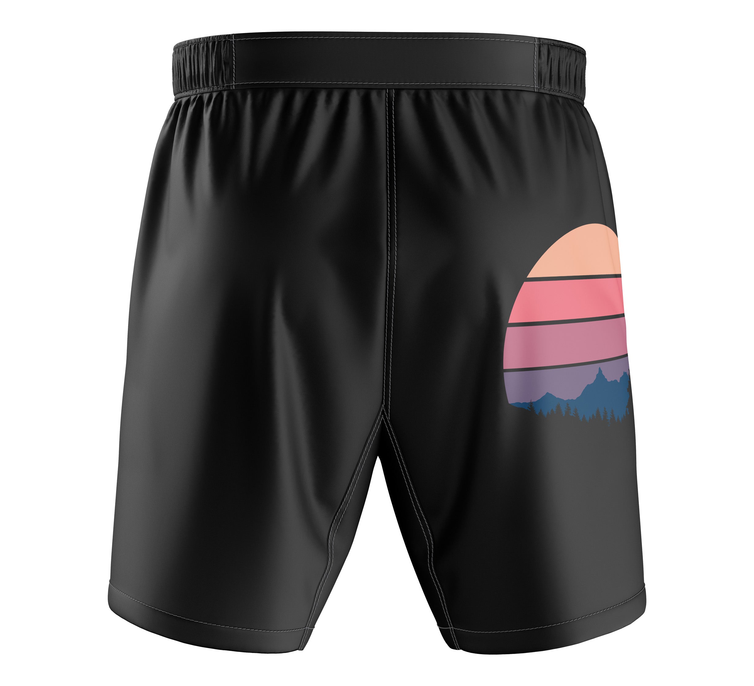 Kids SBG Montana Themed Shorts: black athletic shorts with an elastic waistband and a sunset graphic in pink, orange, and purple hues plus a mountain silhouette on the lower right backside.