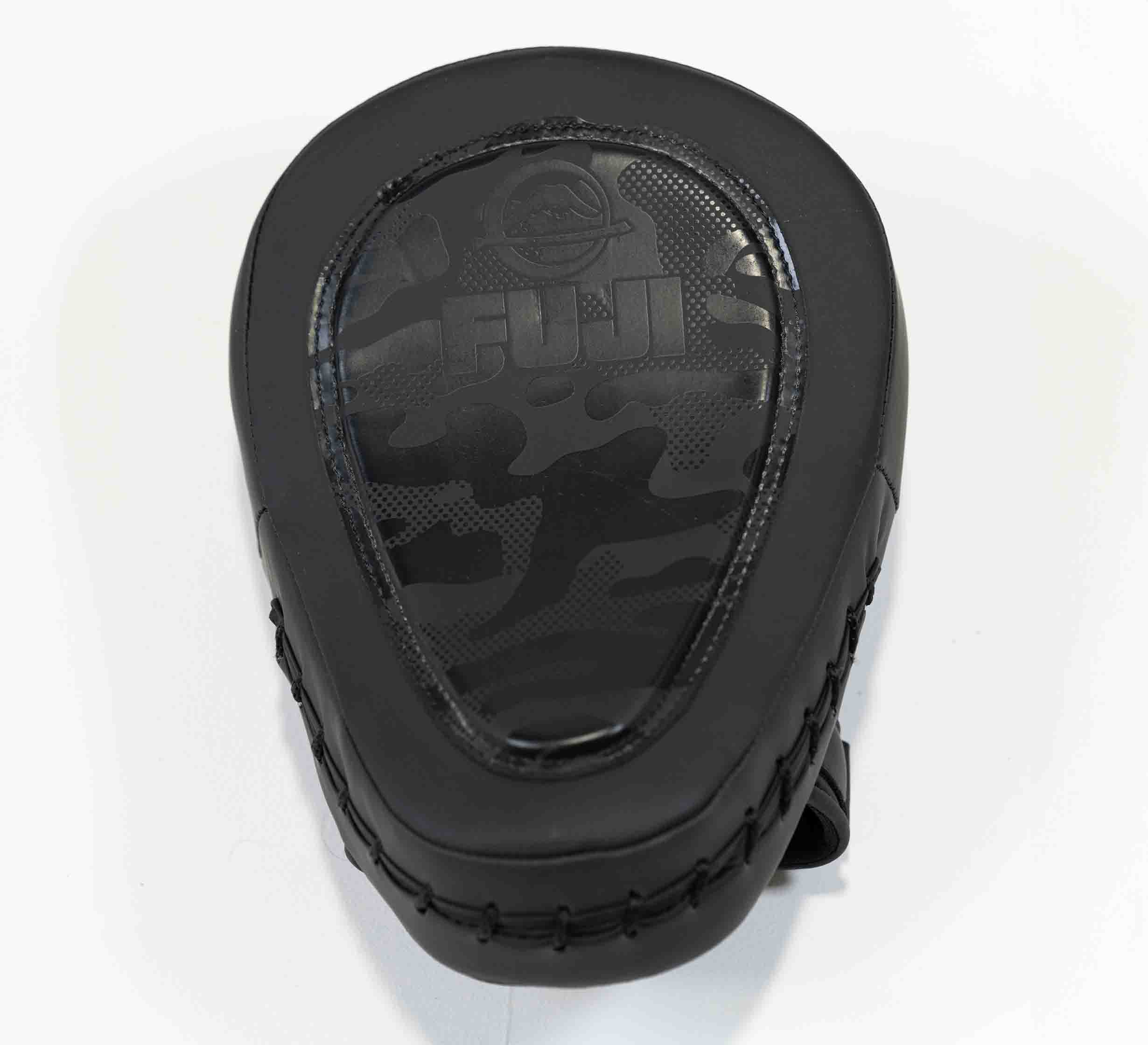 The Raijin Focus Mitts are black, teardrop-shaped pads with camouflage patterns and the FUJI logo on the striking surface, designed for martial arts training.