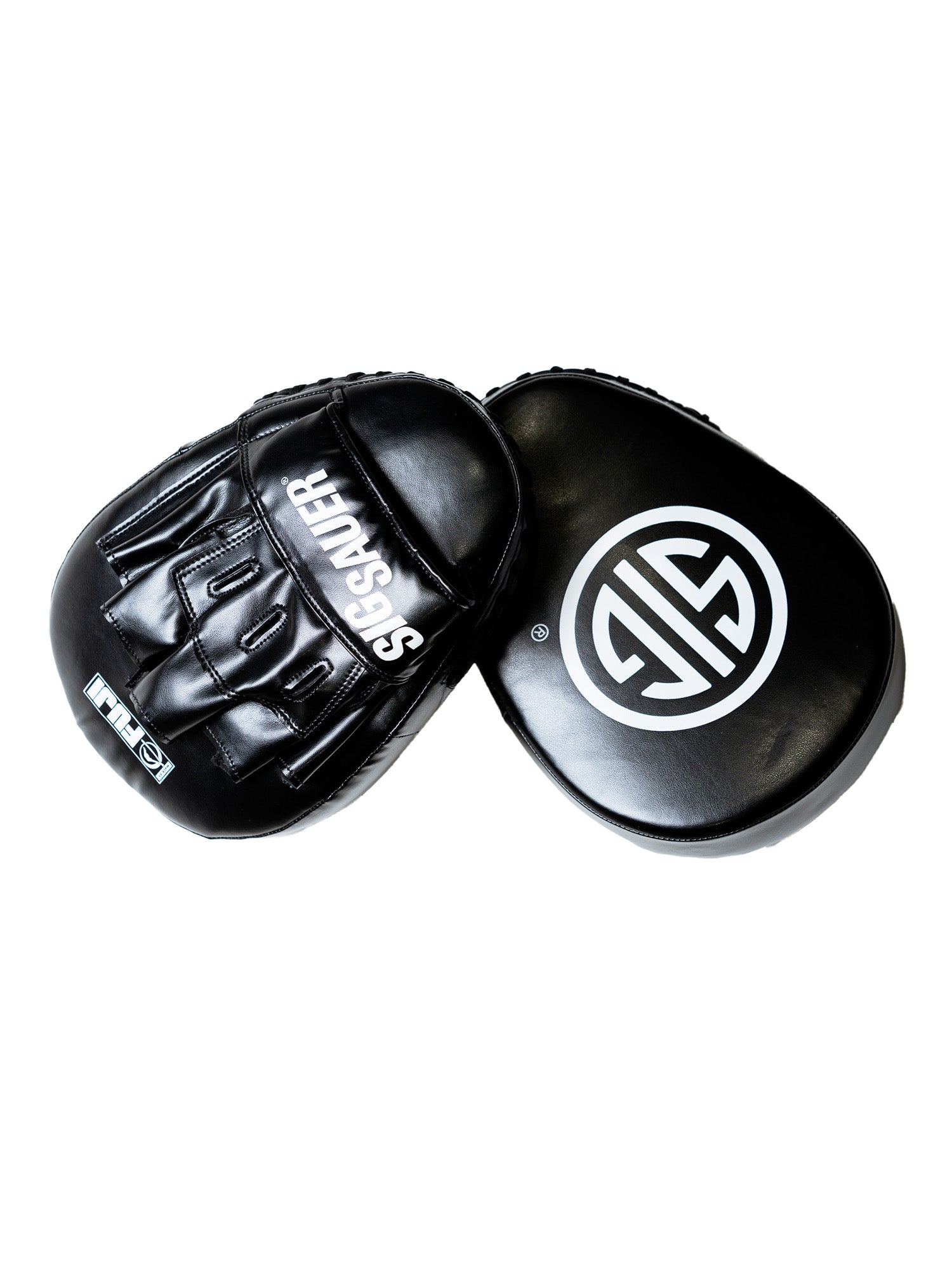 Two black Sig Sauer Focus Mitts: one features "SIG SAUER" in white text with finger slots, while the other displays a bold white circular logo on the striking surface.