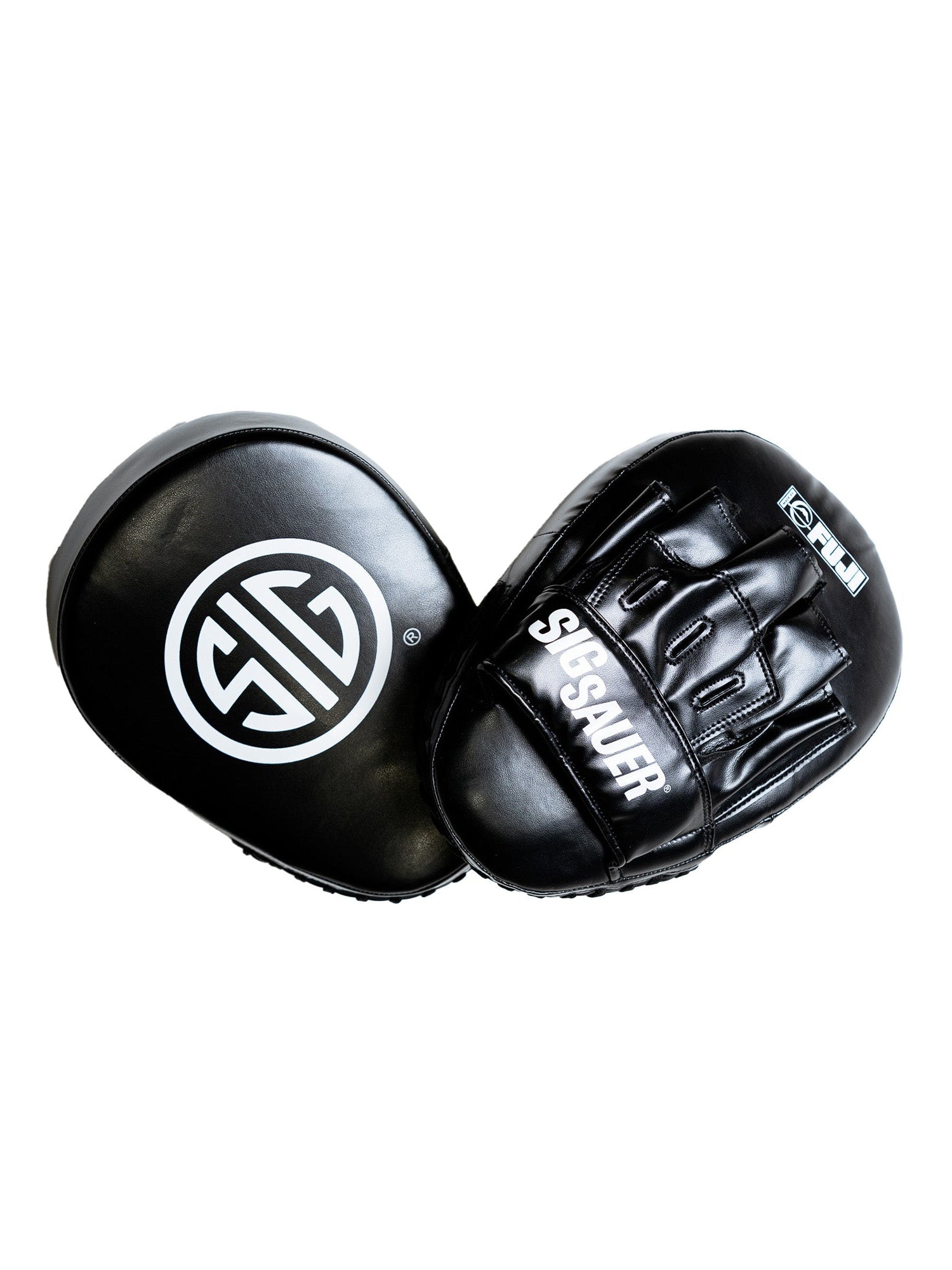 Two black Sig Sauer Focus Mitts: one features "SIG SAUER" in white text with finger slots, while the other displays a bold white circular logo on the striking surface.