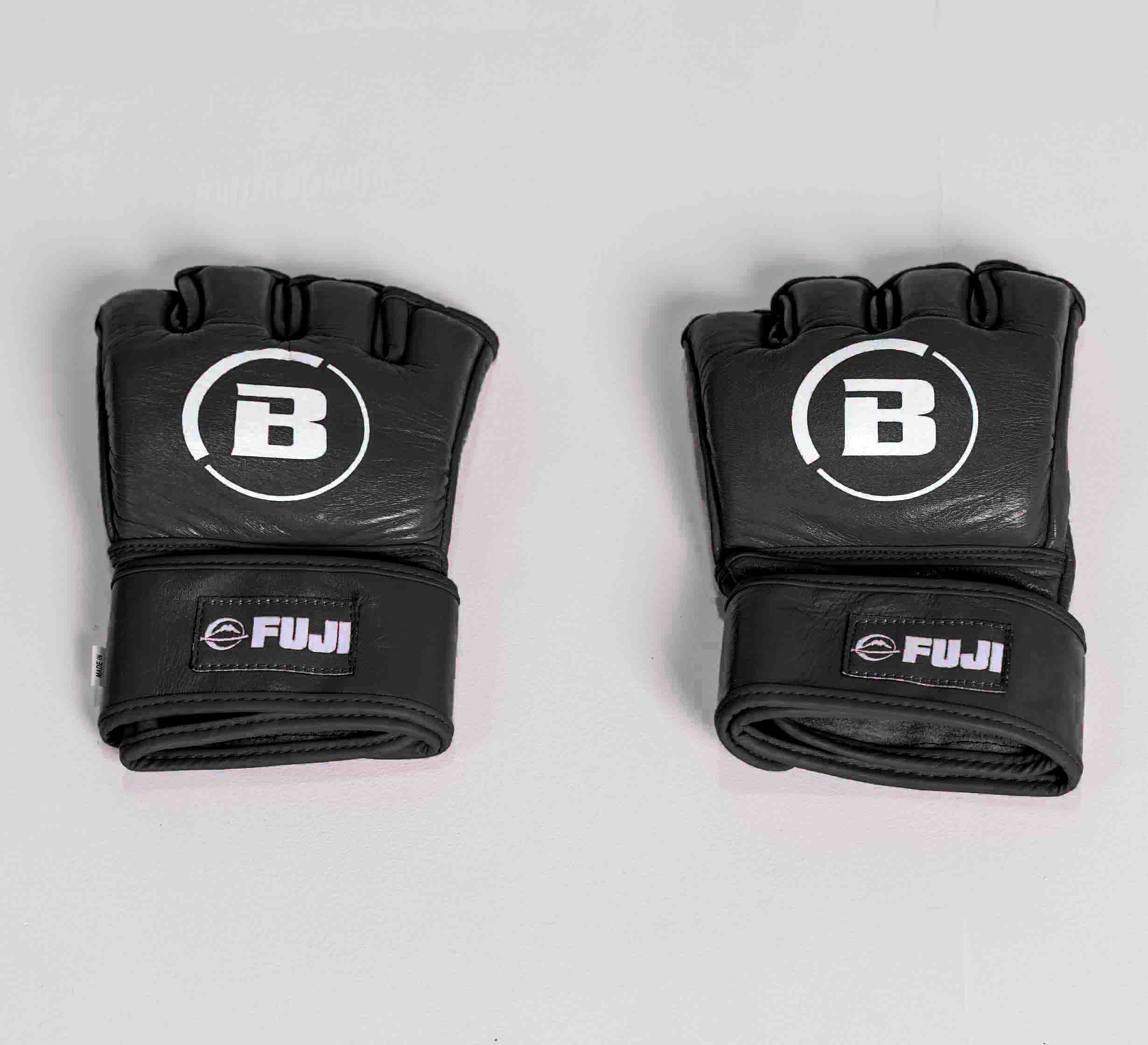 The Bellator MMA Gloves Black feature the Bellator B logo on top and Fuji branding on the wrist straps, displayed on a light gray surface.