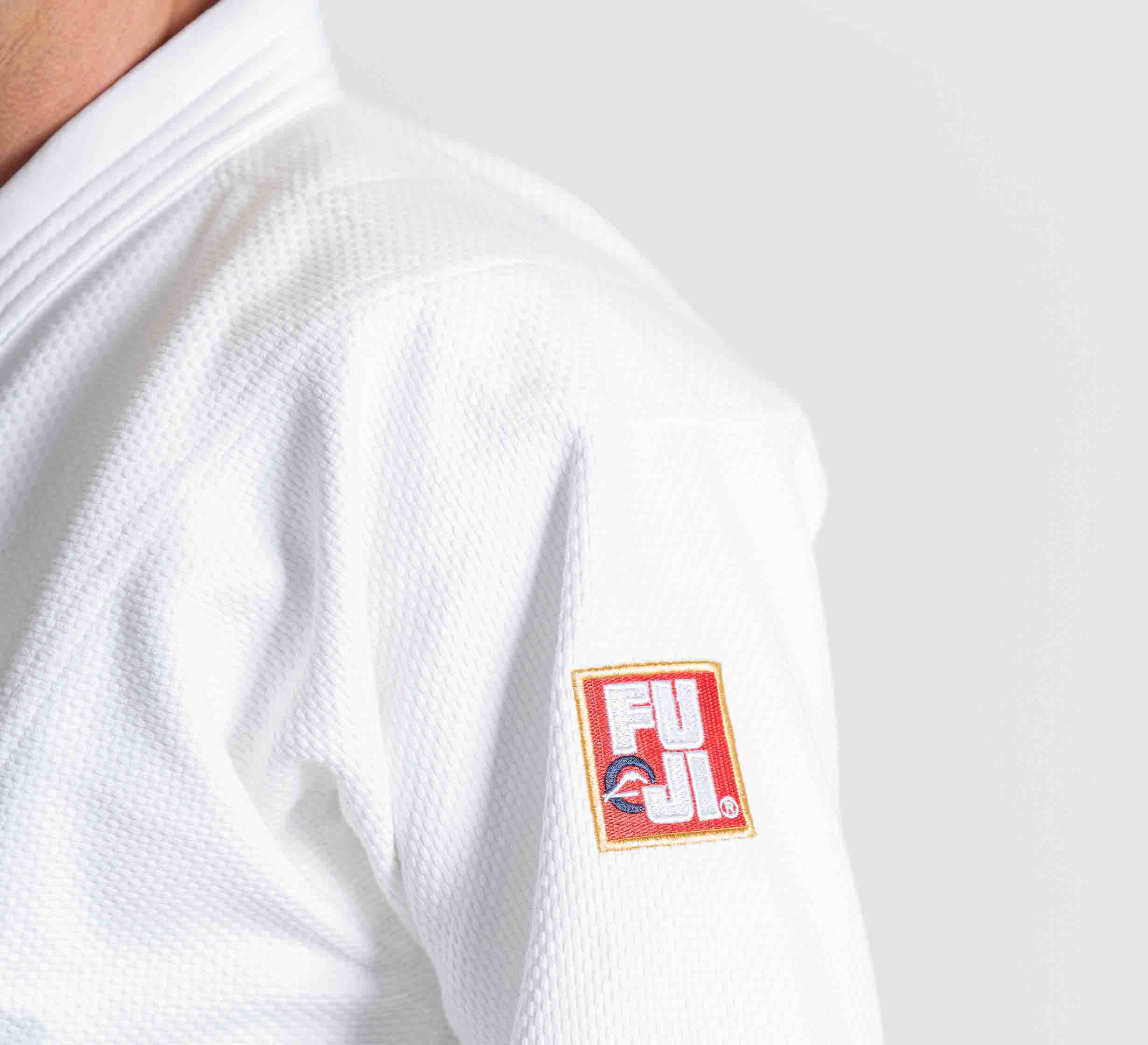 A close-up of a person wearing the Euro Competition Judo Gi White. The person's face is not visible.