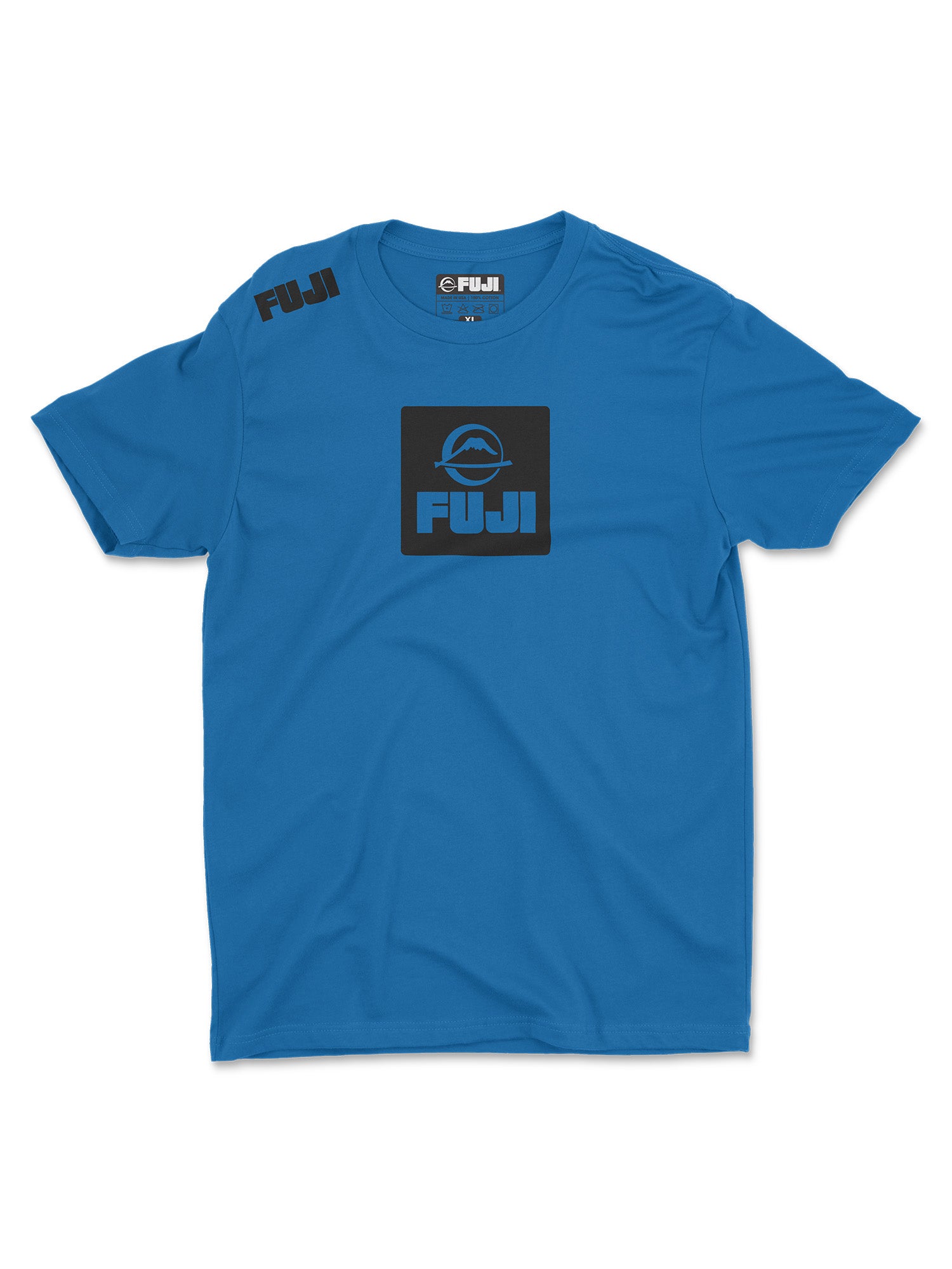 The Elevate Your Journey Shirt Blue is a short-sleeve tee with "FUJI" and a circular black logo on the chest and shoulder, plus the same logo and text inside the collar.