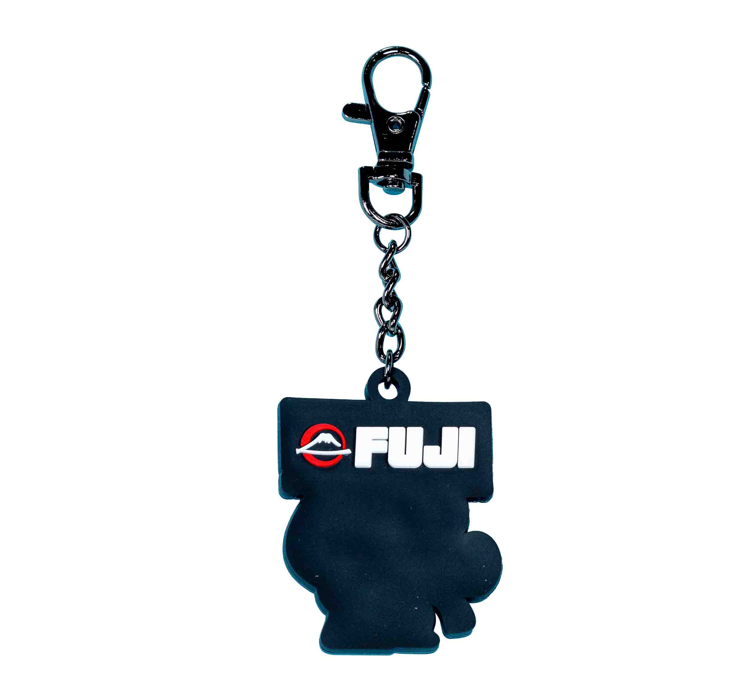 The FUJI Kimono Keychain White features a black silhouette-shaped charm with "FUJI" in white letters, a red and white logo above, and is attached to a black keychain with a metal clasp.
