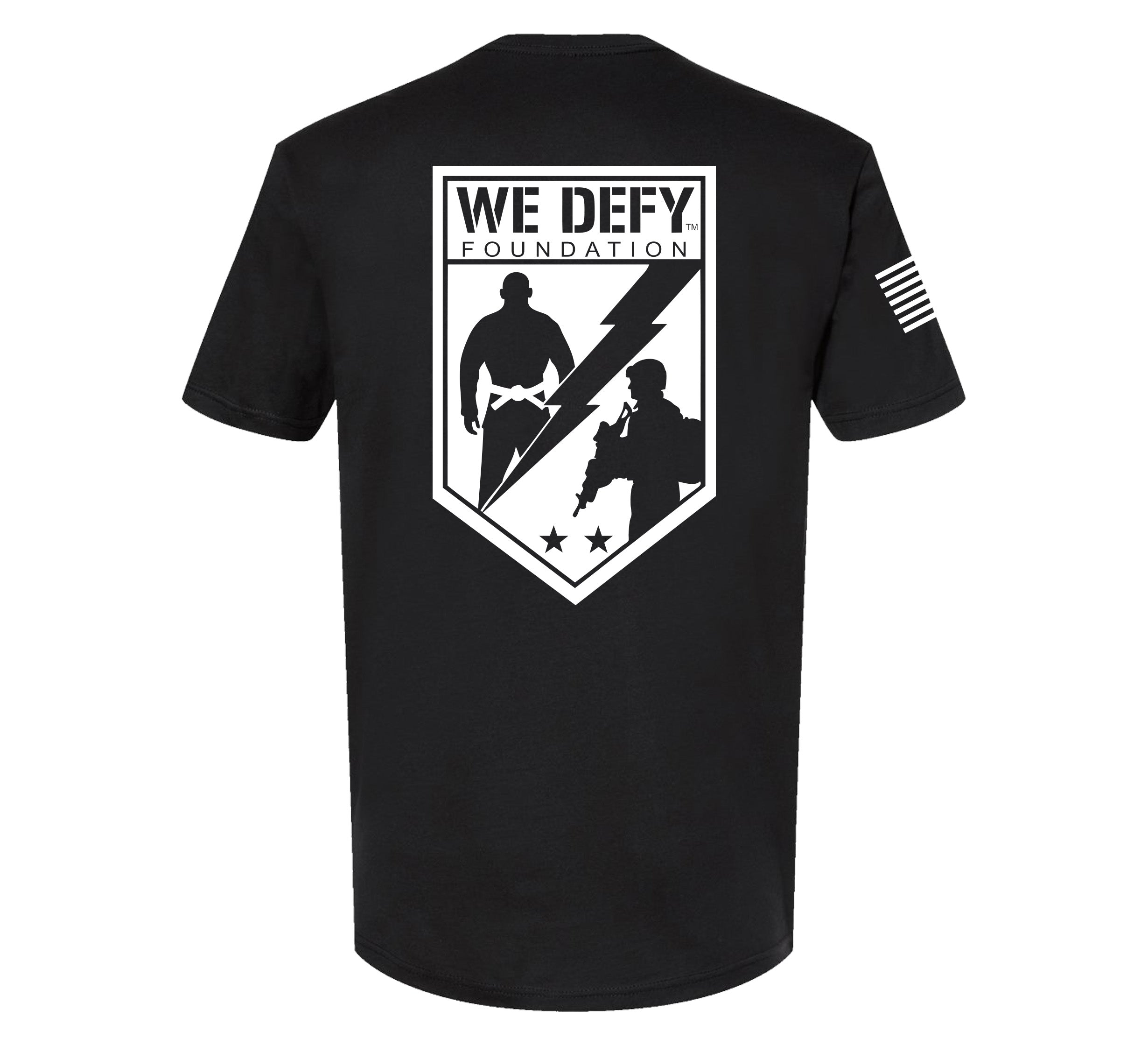 The We Defy Base T-Shirt Black features a large We Defy Foundation logo with two silhouettes, a lightning bolt, and three stars on the back, plus an American flag on the right sleeve.
