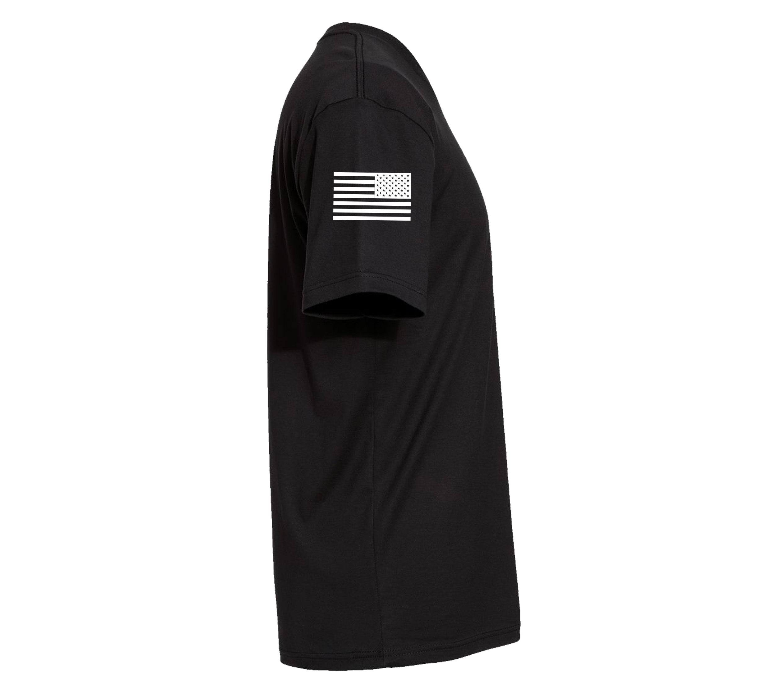 The We Defy Base T-Shirt Black is shown from the side, featuring a white American flag design on the right short sleeve.