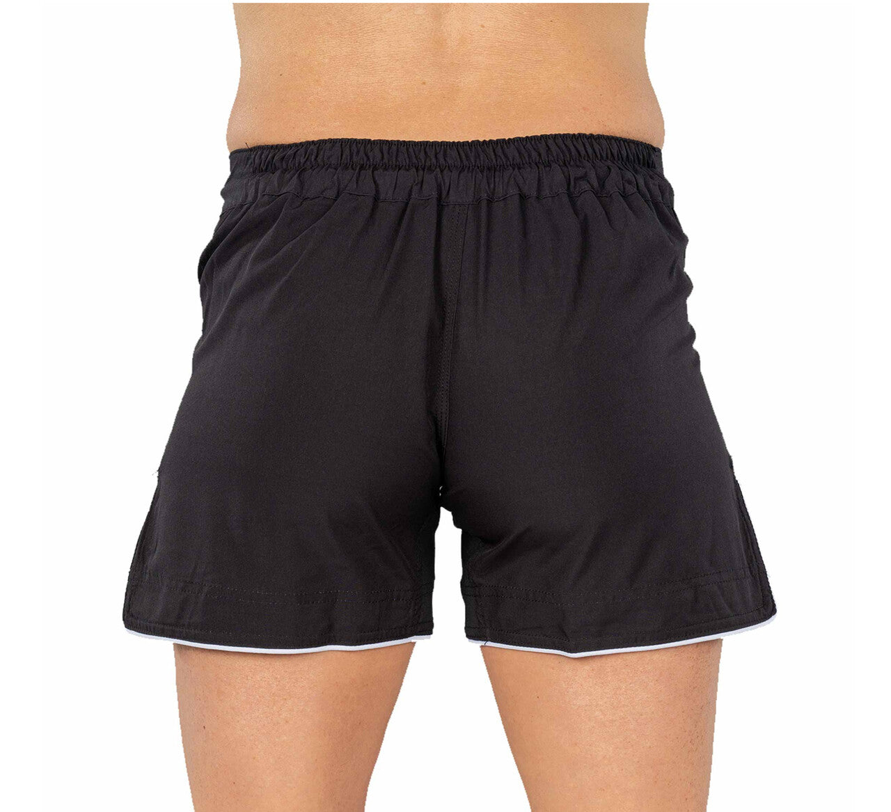 A person shown from the back against a white background is wearing BTT Womens Baseline Shorts Black with an elastic waistband.