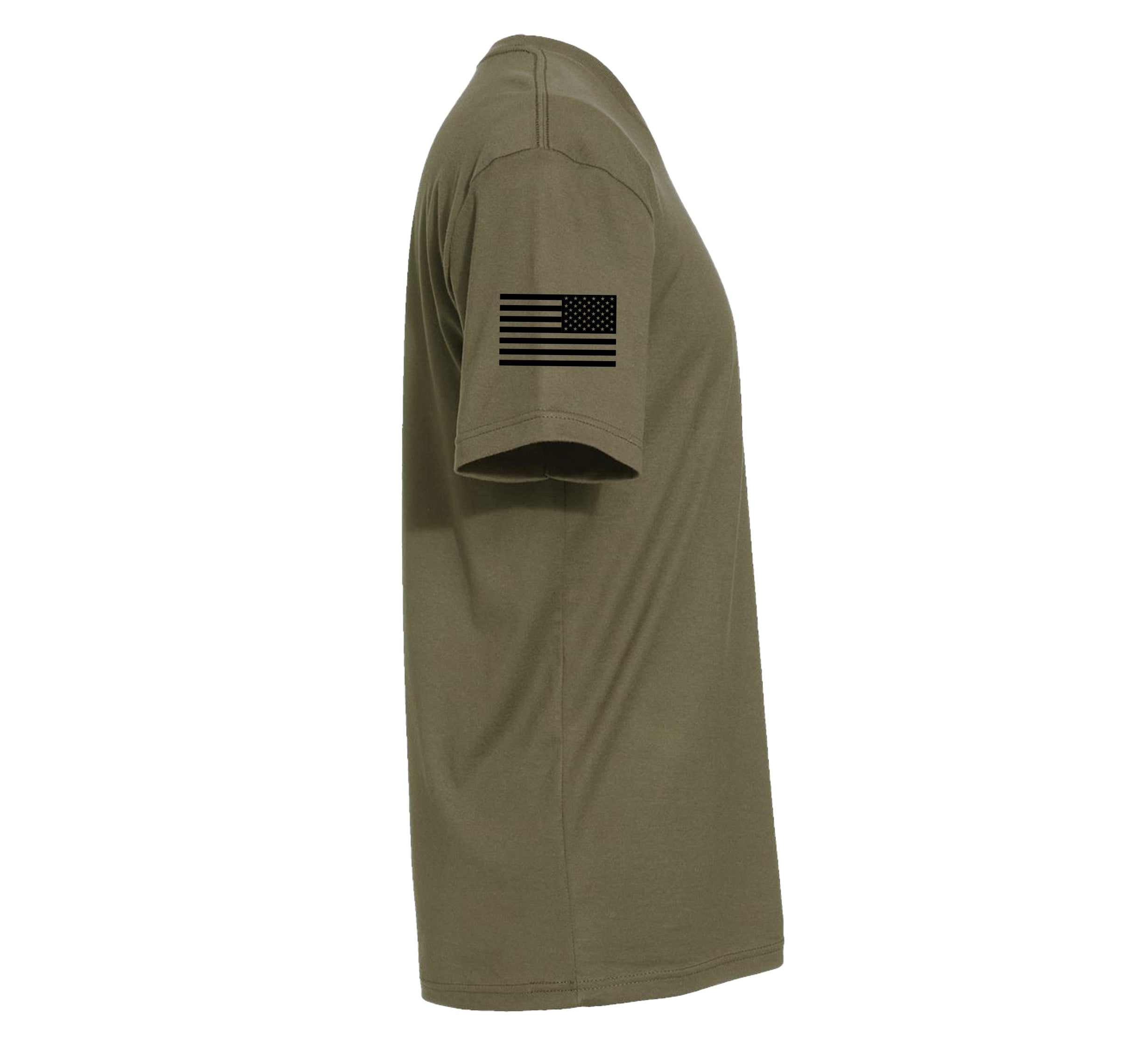 The We Defy Core T-Shirt Military Green is a short-sleeve olive green tee viewed from the side, featuring a black American flag design on the upper sleeve.