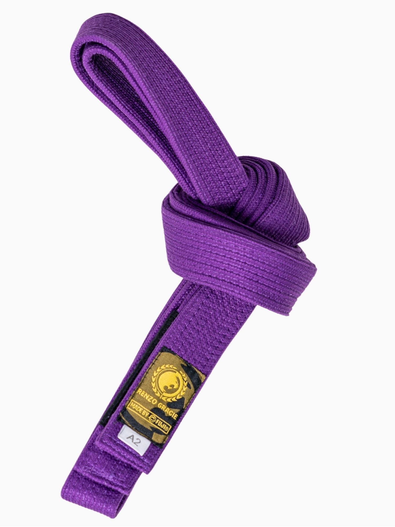 The Renzo Gracie Premium Pearl Weave BJJ Belt in purple features a neatly knotted design with a black and gold patch showing the logo and "RANKED SERIES," displayed on a plain white background.