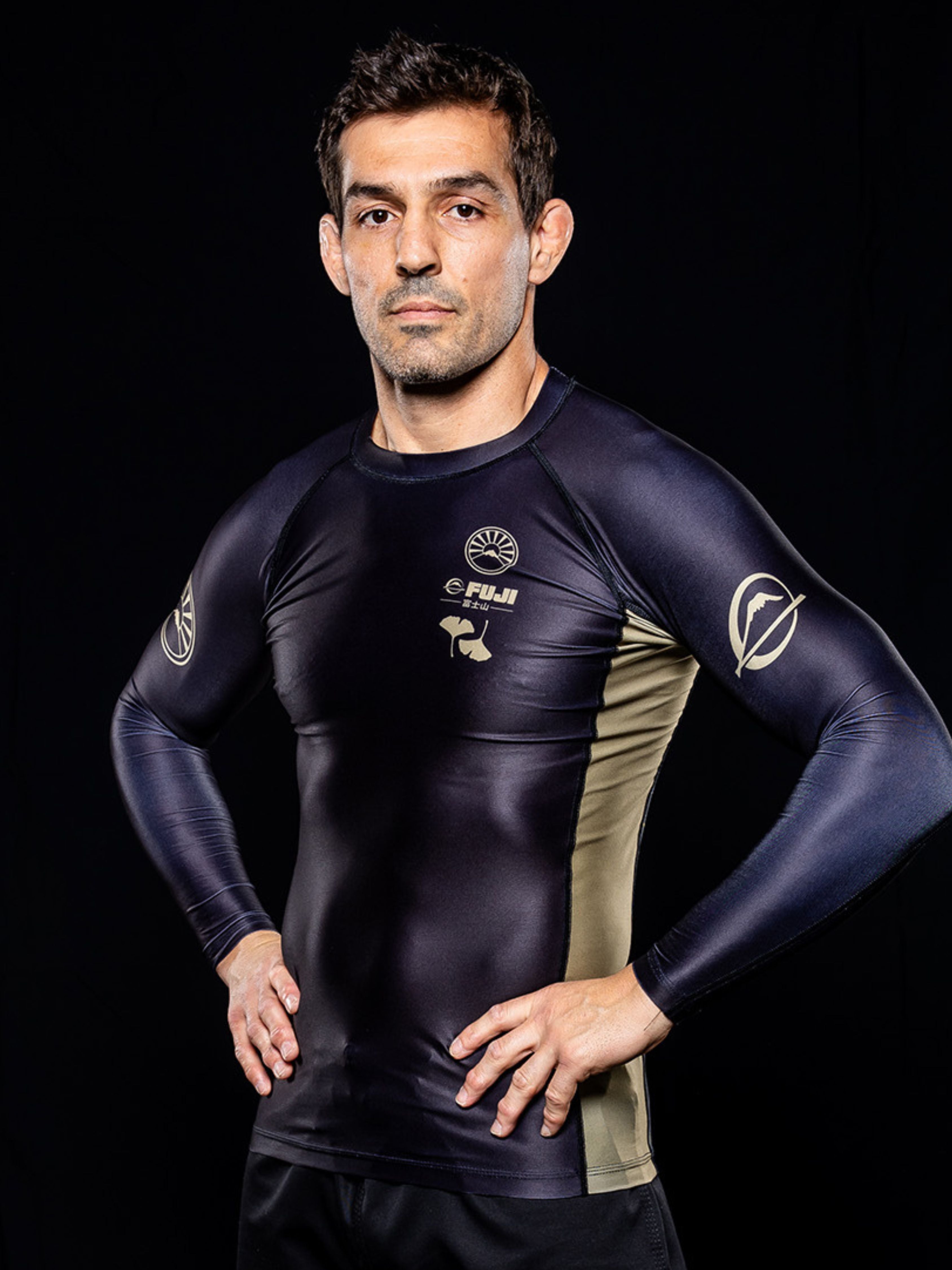 Clad in the Heritage Keishō Edition Bundle, a man stands confidently with hands on hips against a plain dark background.