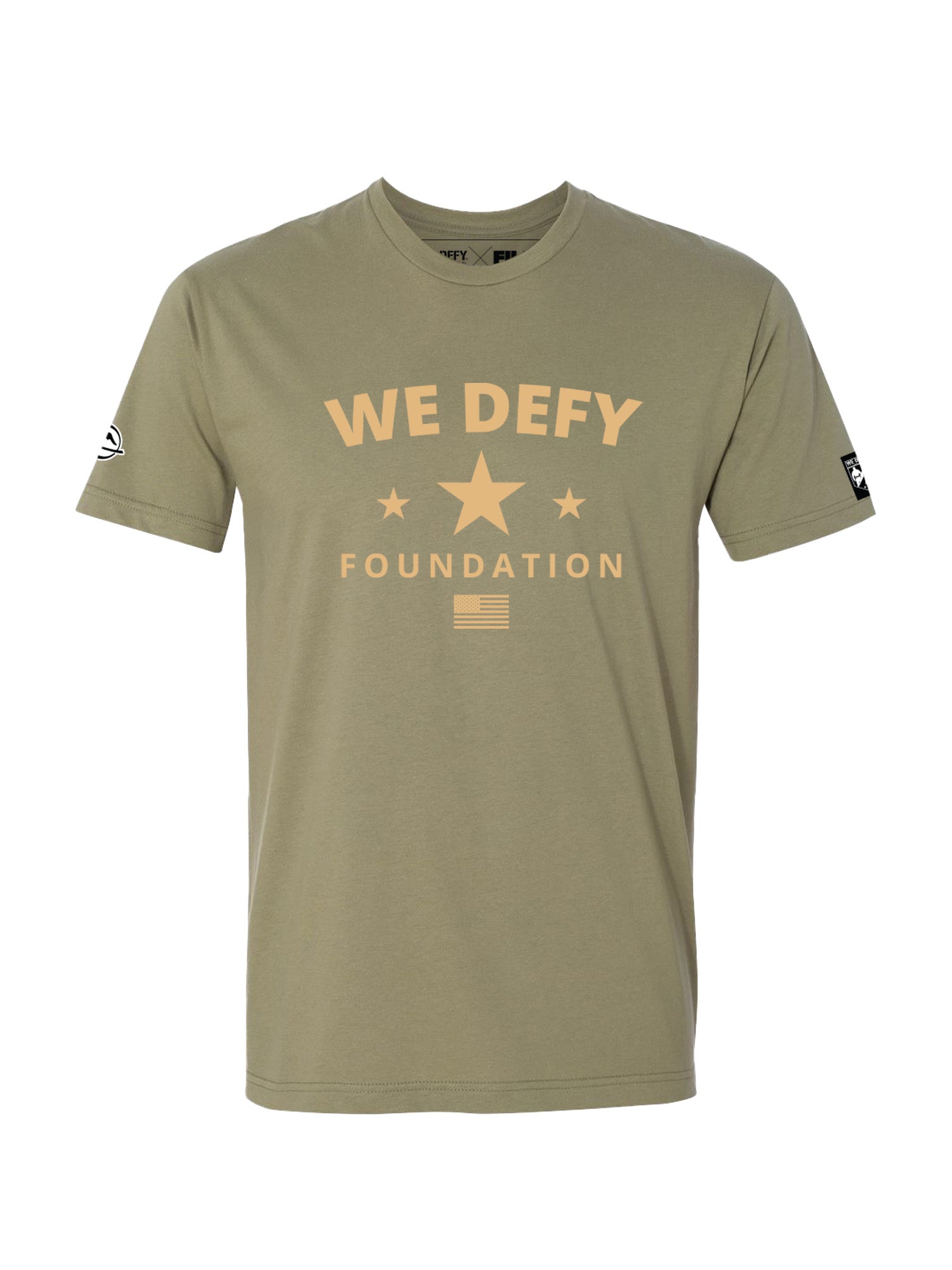 The We Defy Retro Star Light Olive T-Shirt Green features “WE DEFY FOUNDATION” in large tan letters, a star with two smaller stars beneath, a small American flag graphic, and sleeve logos.