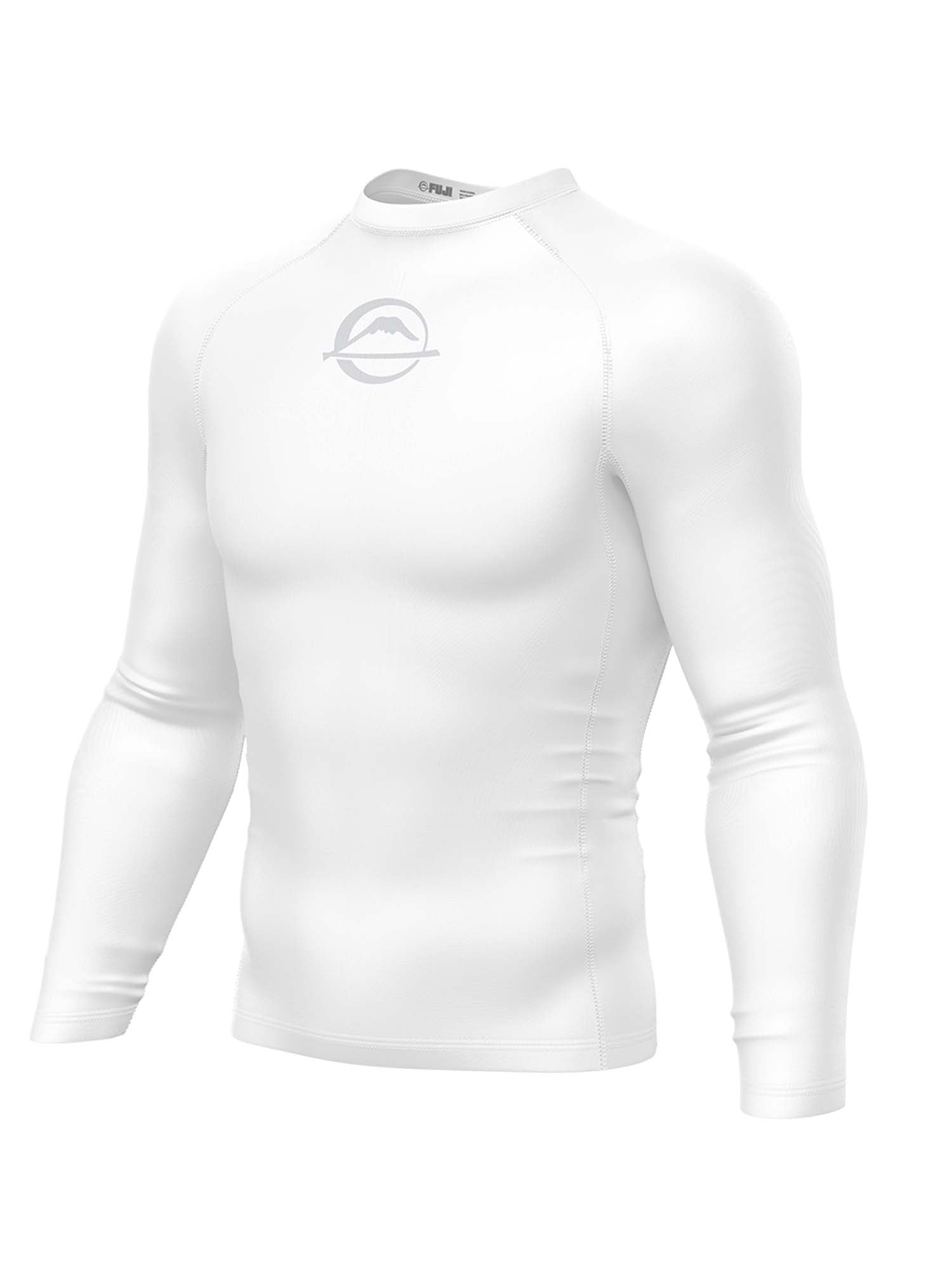 The Baseline Ranked Long Sleeve Rashguard White is a white, long-sleeve compression shirt with a subtle mountain-and-circle logo on the chest, displayed on a featureless mannequin torso against a plain white background.