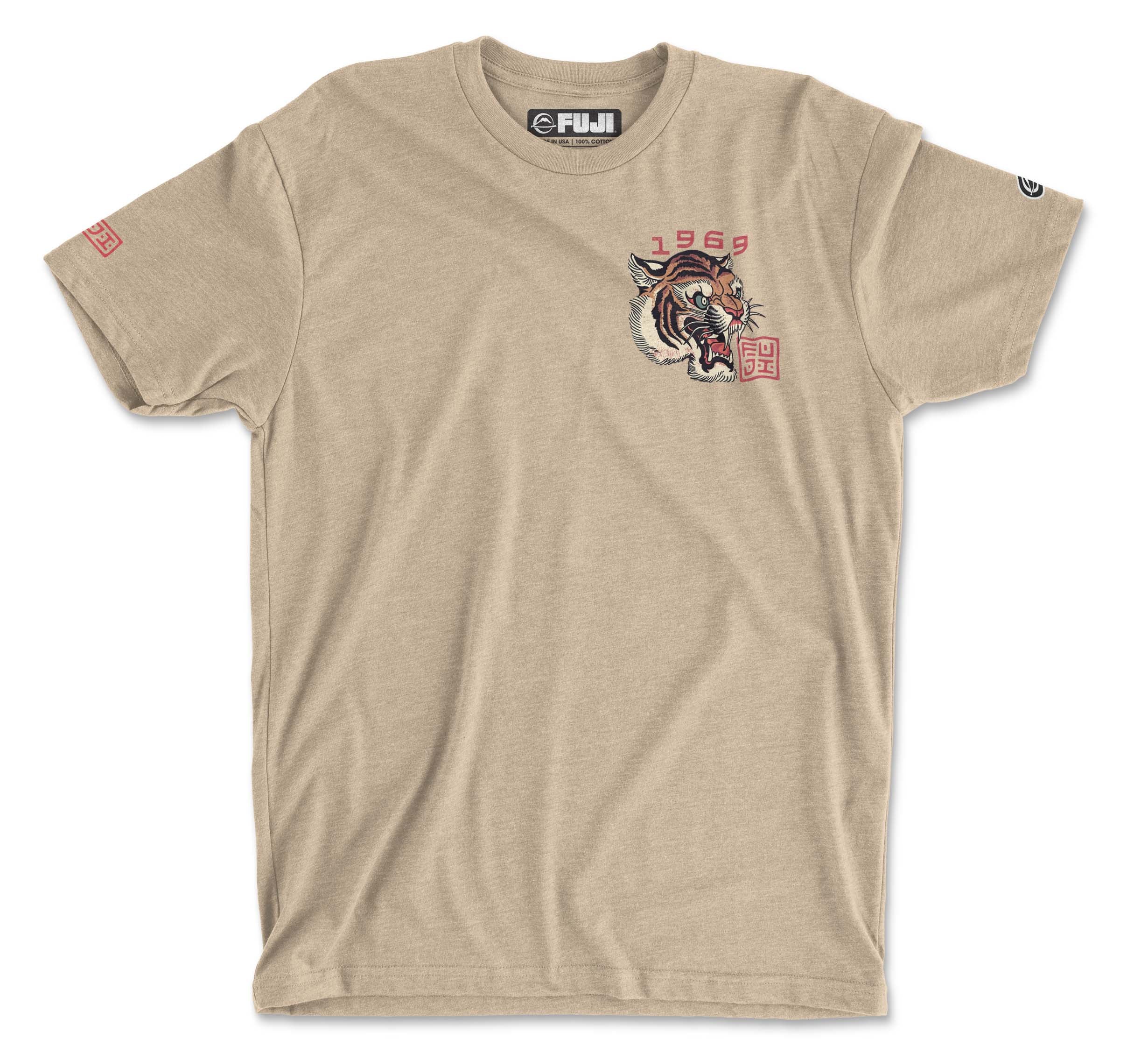 The Tora T-Shirt Cream features a detailed tiger head on the left chest, with "1969" in red above and a red square with Asian-inspired characters below, plus subtle logos on the collar and right sleeve.