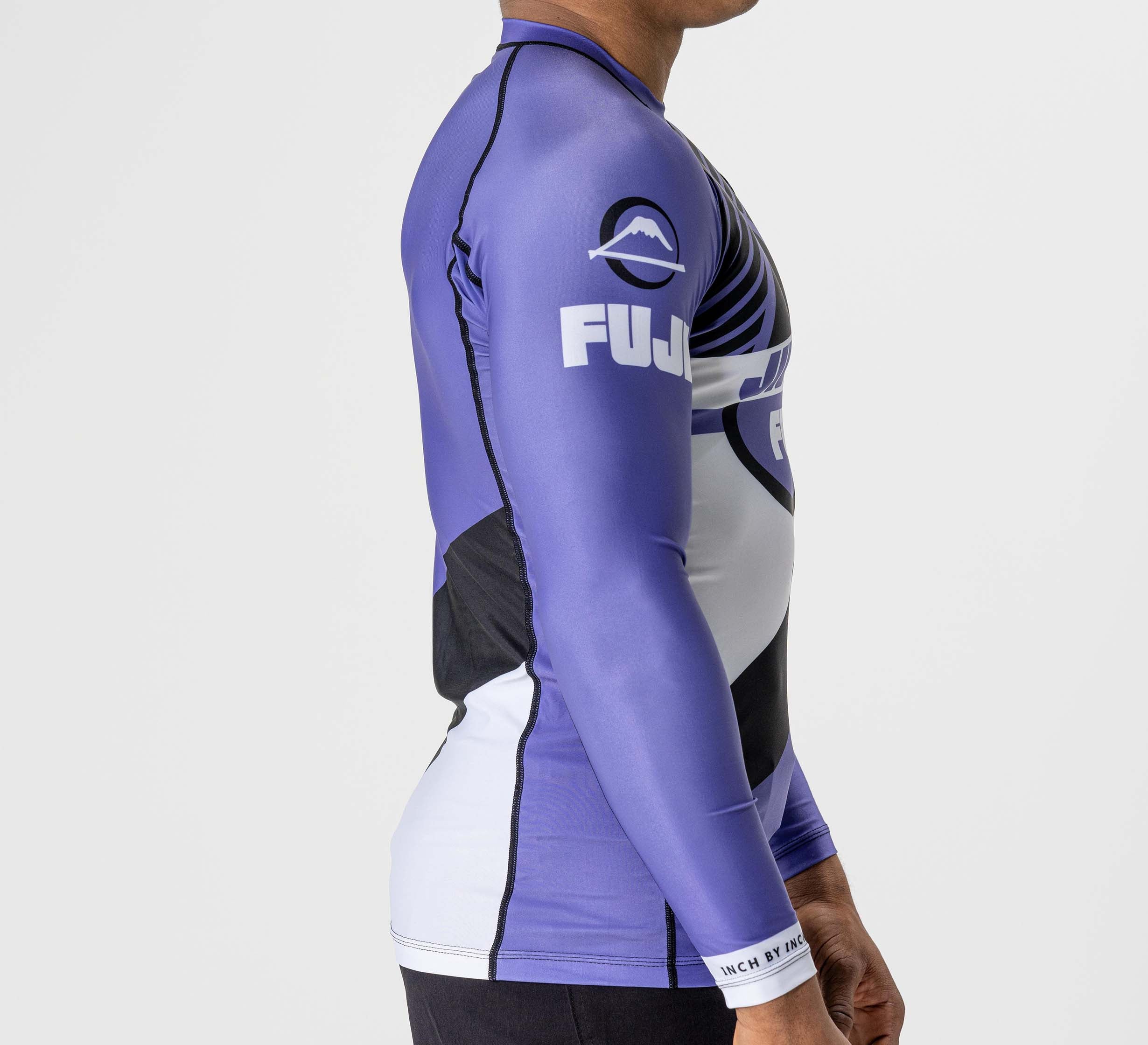 A man wearing the Pacer Flex Lite Long Sleeve Rashguard in purple.