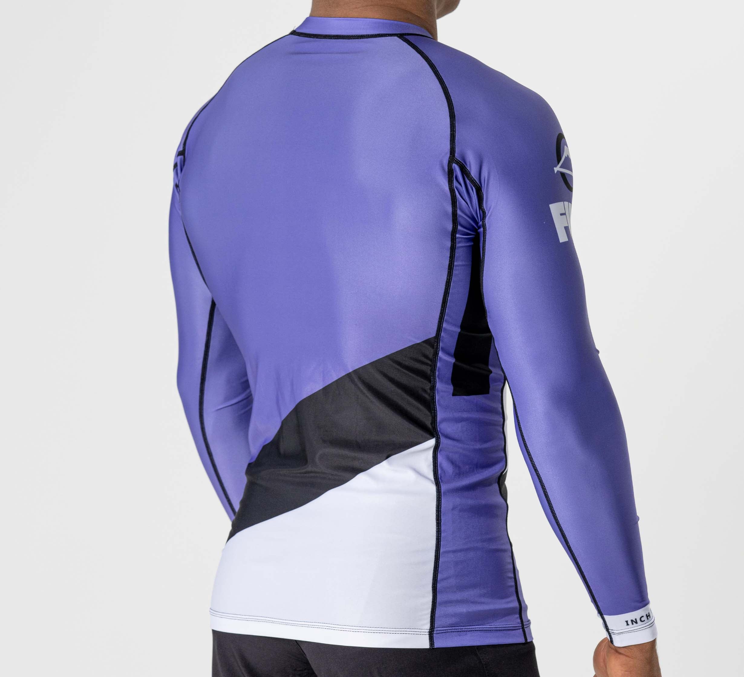 A person wearing the Pacer Flex Lite Long Sleeve Rashguard in purple, featuring black and white color blocks, shown from the back against a plain white background.