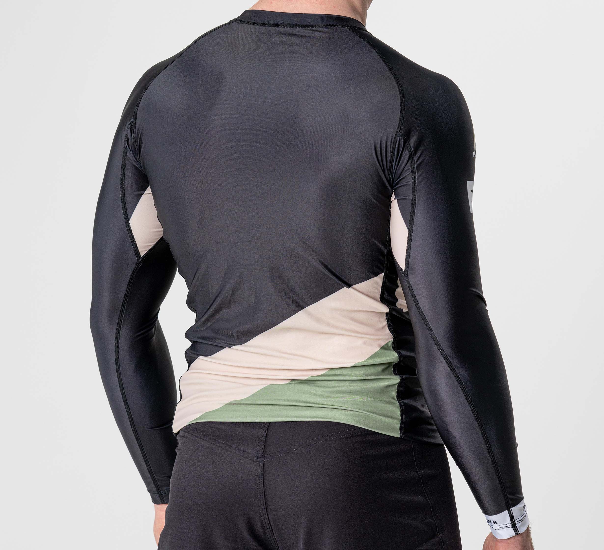 Someone is shown from the back wearing the Pacer Flex Lite Long Sleeve Rashguard Black, featuring black, beige, and green geometric panels, against a plain white background.