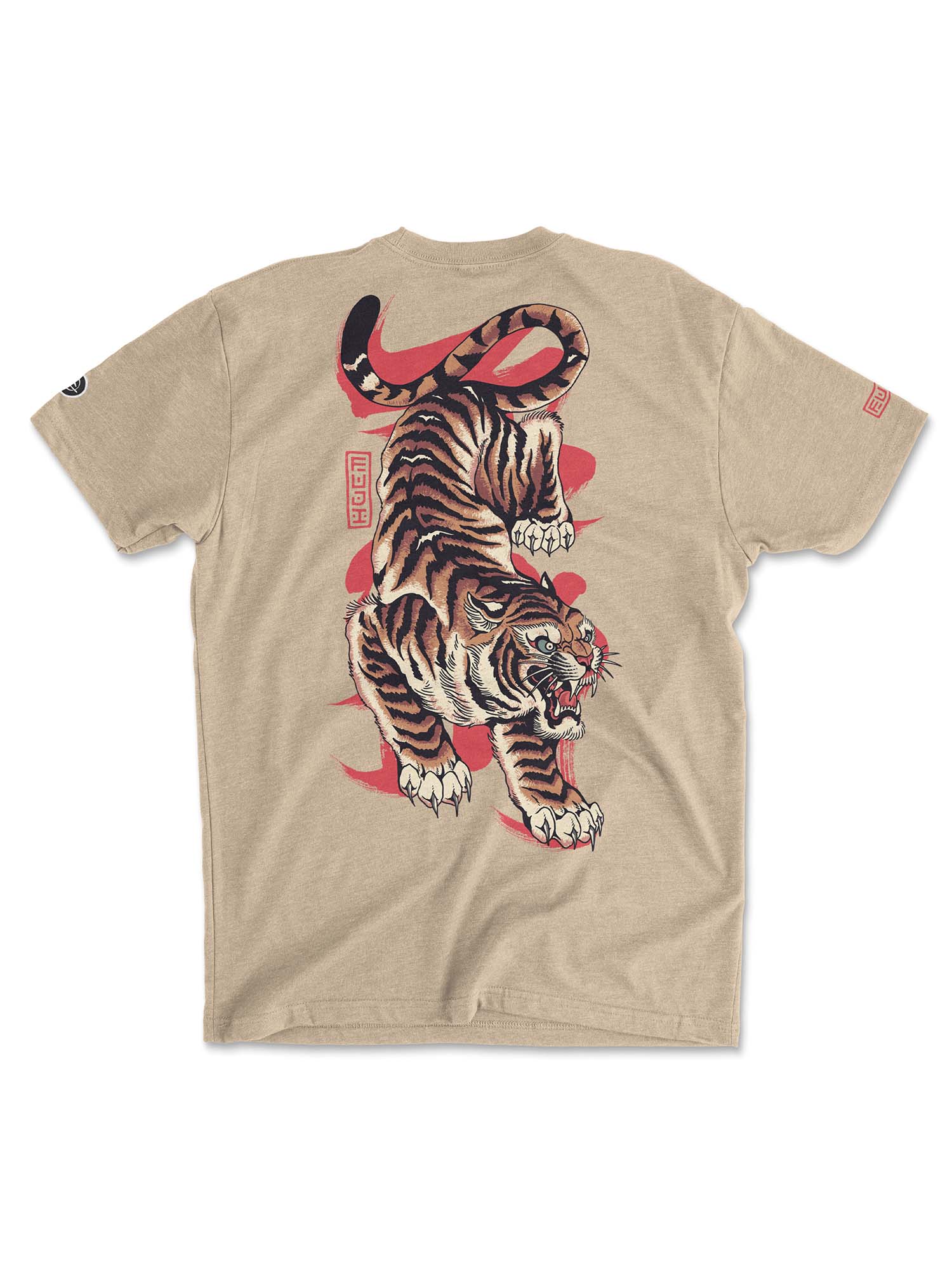 The Tora T-Shirt Cream features a bold, detailed roaring tiger with raised claws on the back, highlighted by red brushstroke patterns and stylized text elements.
