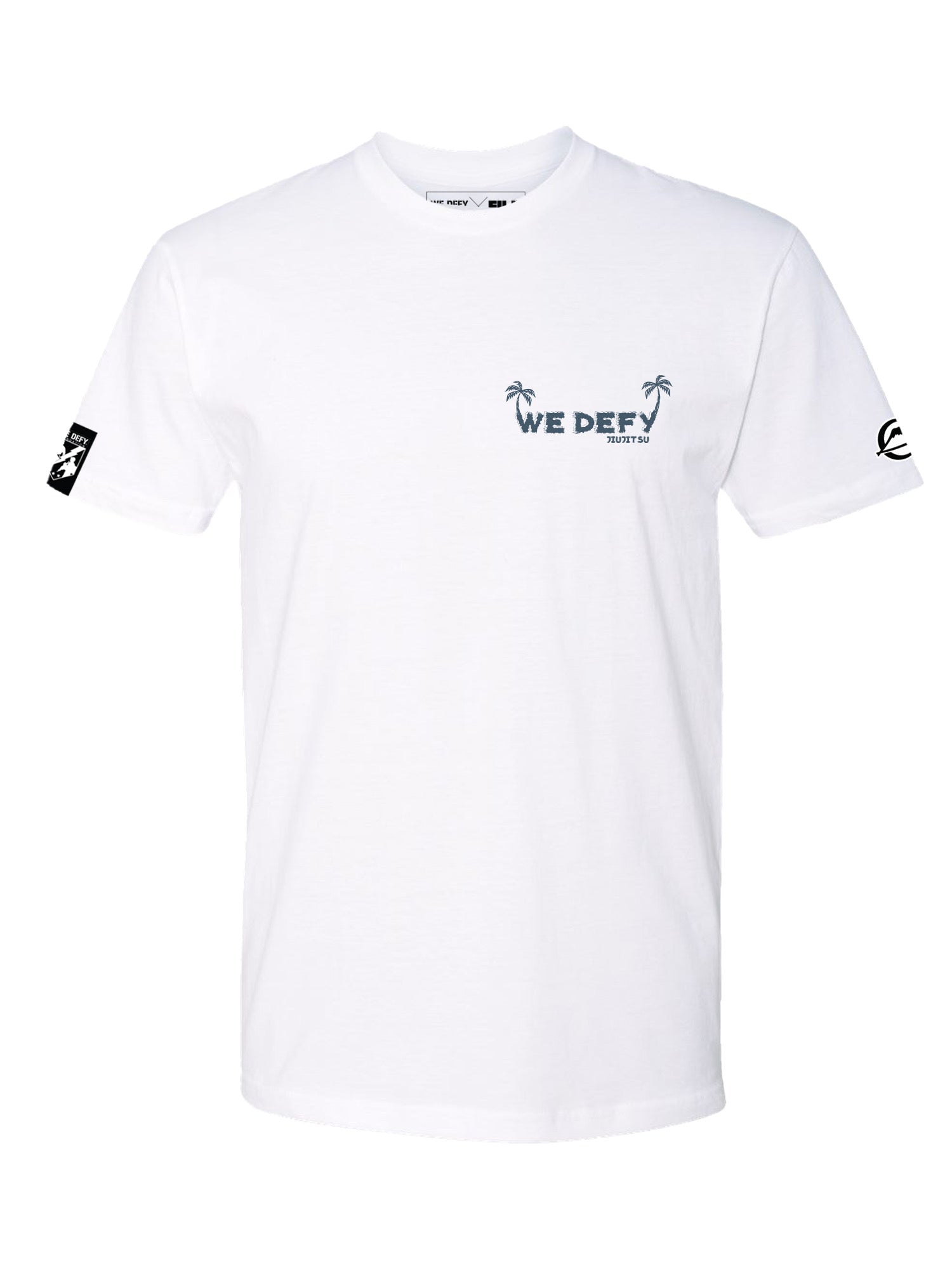The We Defy Beach Vibes T-Shirt White features “WE DEFY” and a small palm tree graphic on the left chest, black logo patches on both sleeves, and a simple, clean short-sleeve design.