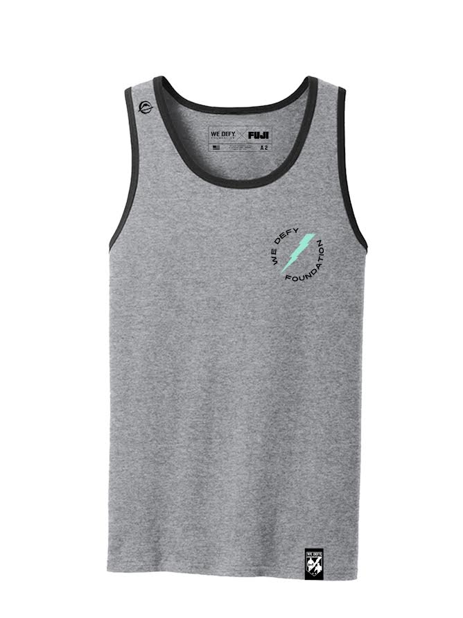 The We Defy Lightning Bolt Tank Top in gray features black trim on the collar and armholes, a small blue feather graphic with surrounding text on the left chest, and a black patch sewn near the bottom hem.