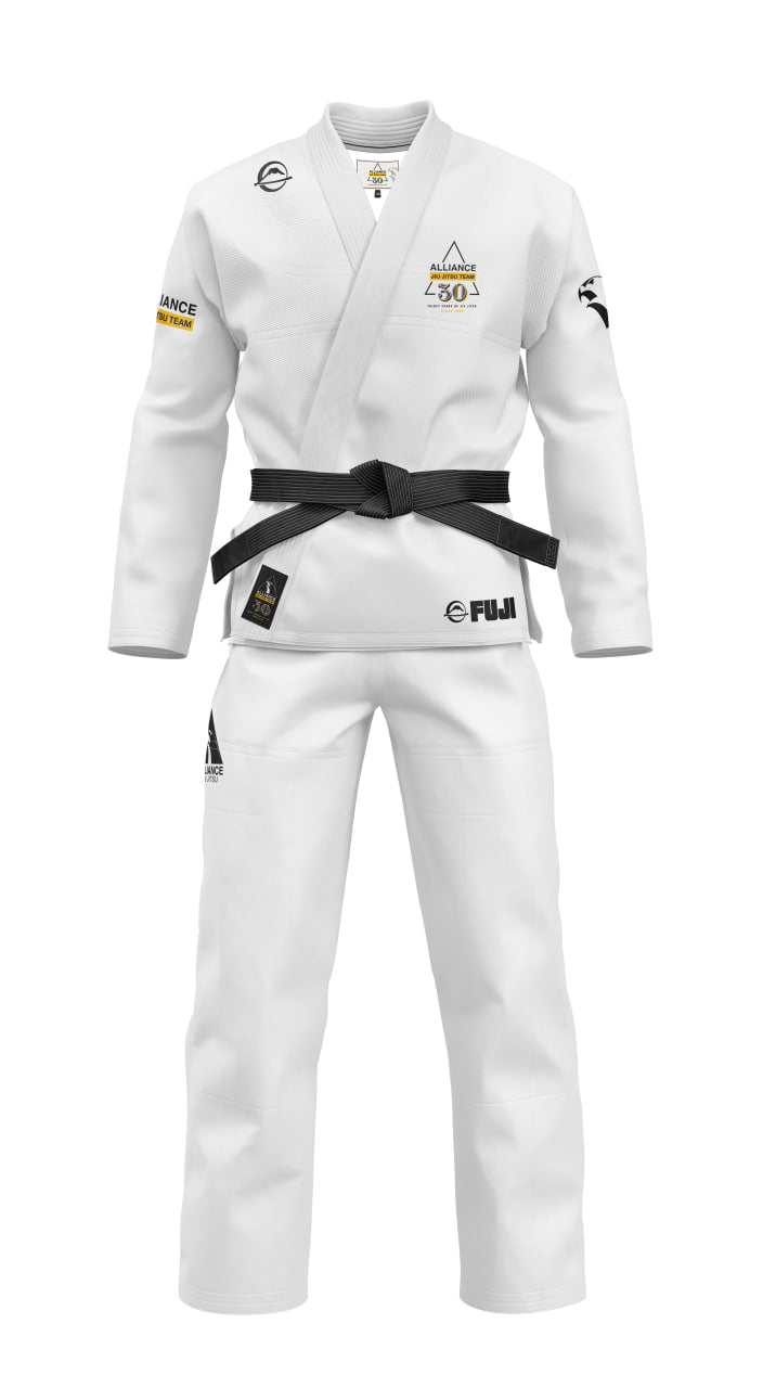 The Womens Alliance Limited Edition 30th Anniversary BJJ Gi White features Alliance team patches, a 30 Years chest logo, and Fuji branding on the pants and jacket. The white gi includes a black belt and is shown on an invisible mannequin.