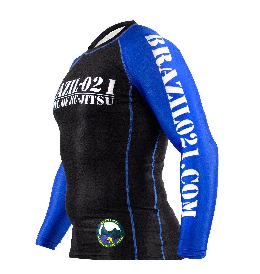 The BRAZIL 021 Ranked Rashguard is a long-sleeve BJJ top with blue arms, a black torso, white BRAZIL-021 and BRAZIL021.COM text, and a small round logo near the waist.