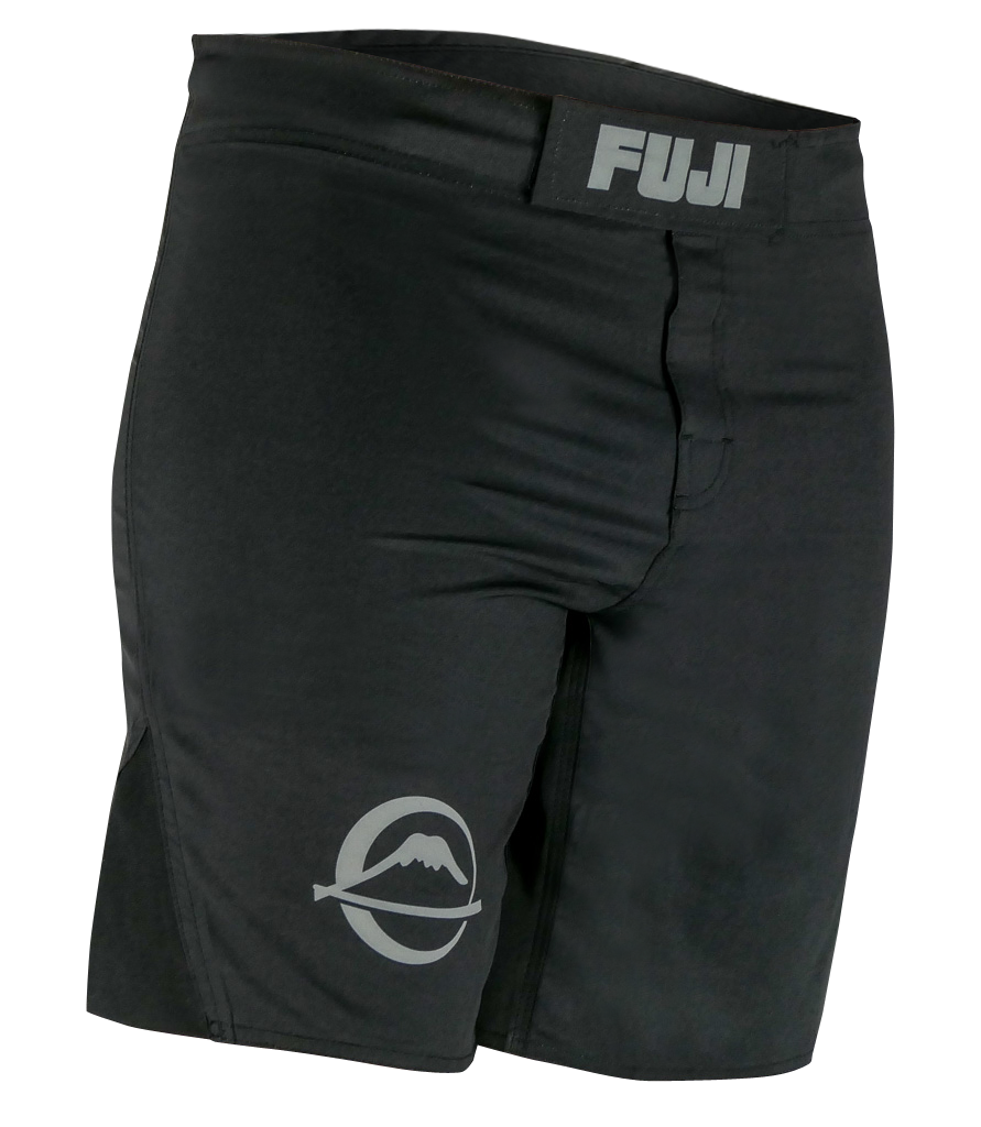 A pair of Baseline Fight Shorts in black featuring a Velcro waistband labeled FUJI and a circular mountain logo on the left leg.
