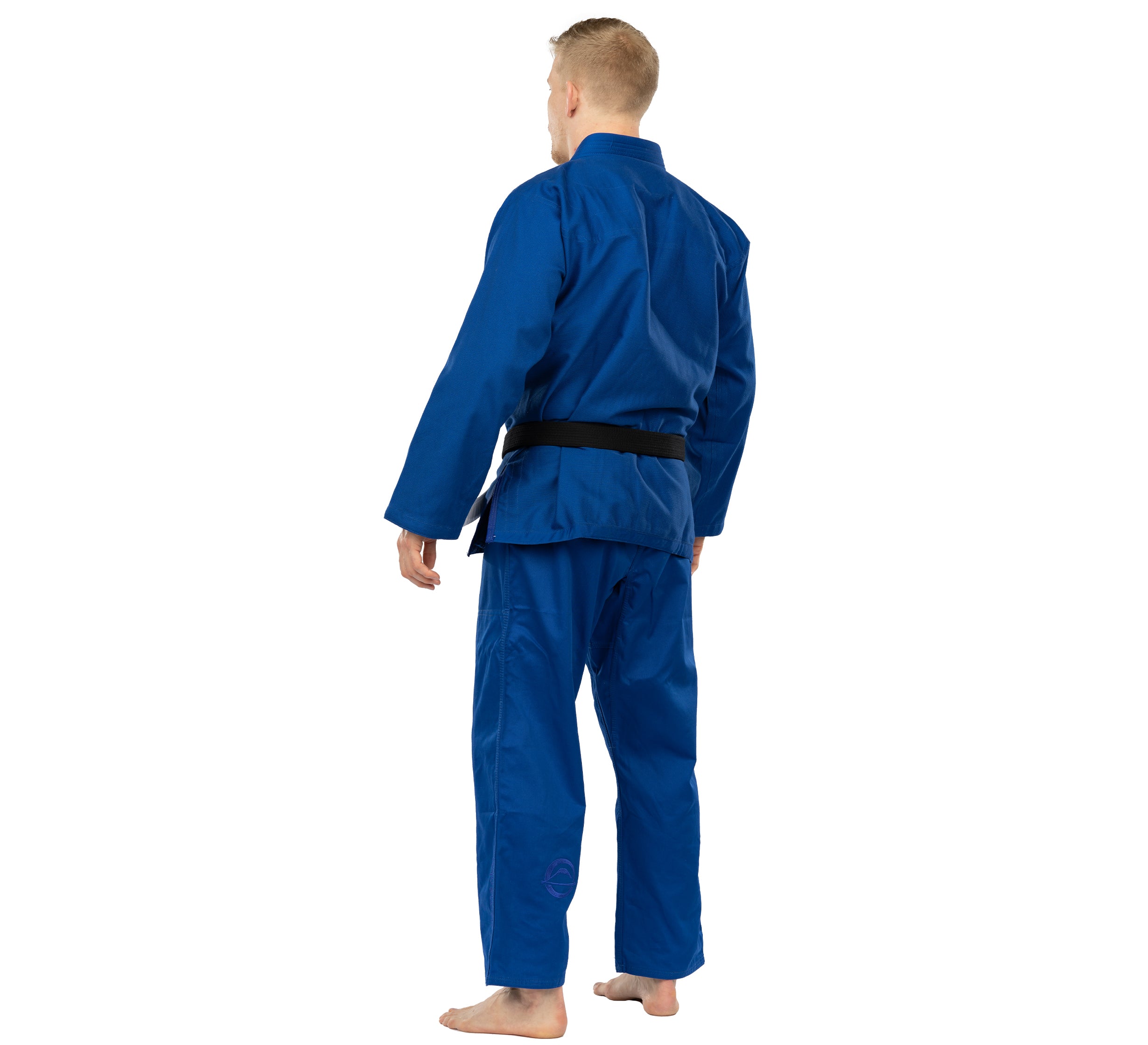 A person wearing the Elemental BJJ Gi Blue and a black belt stands barefoot, facing away from the camera against a white background.