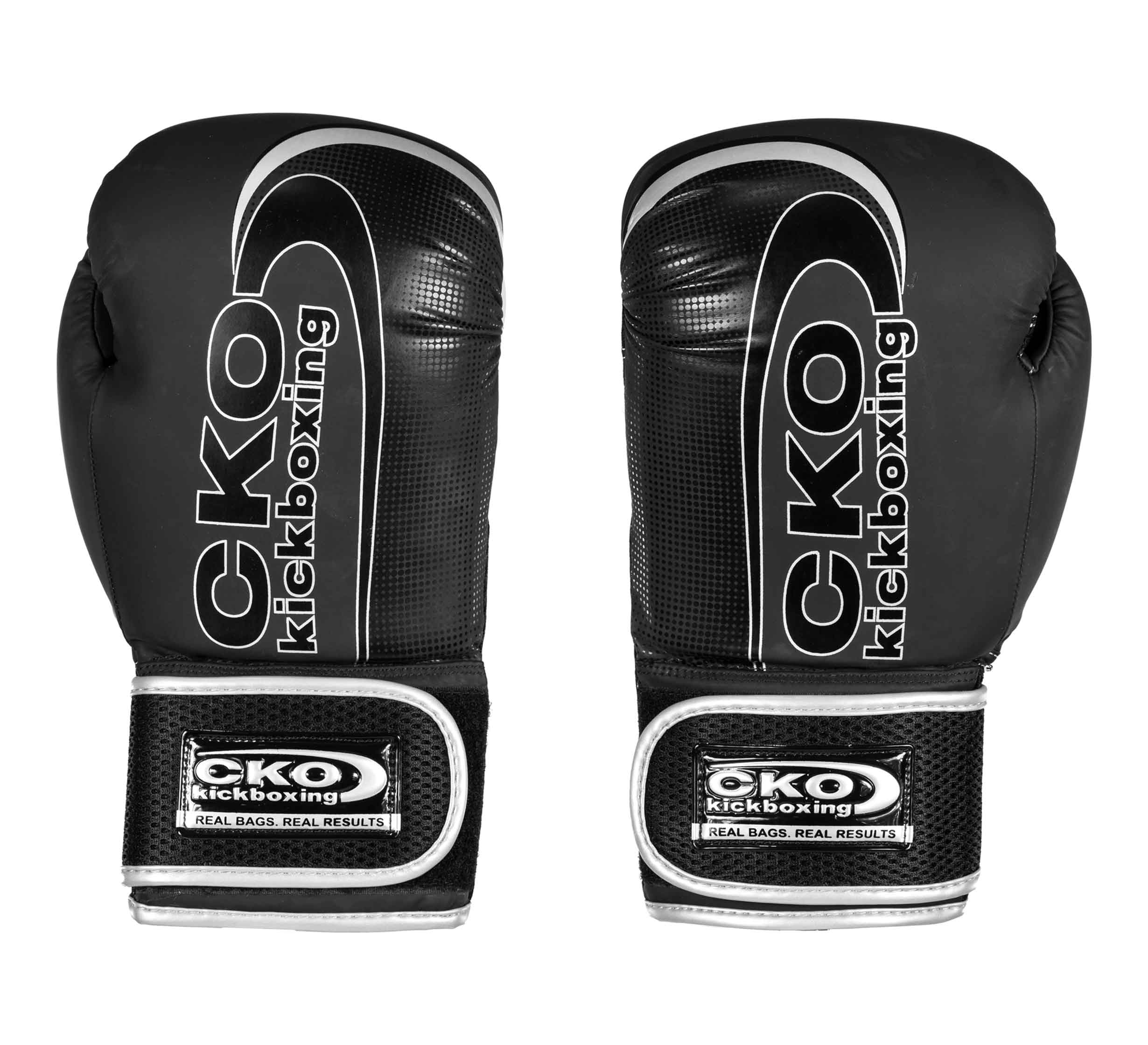 The CKO Baseline Gloves Black feature white and silver accents, the CKO Kickboxing logo on the back and wrist straps, and are shown upright with palms facing inward.