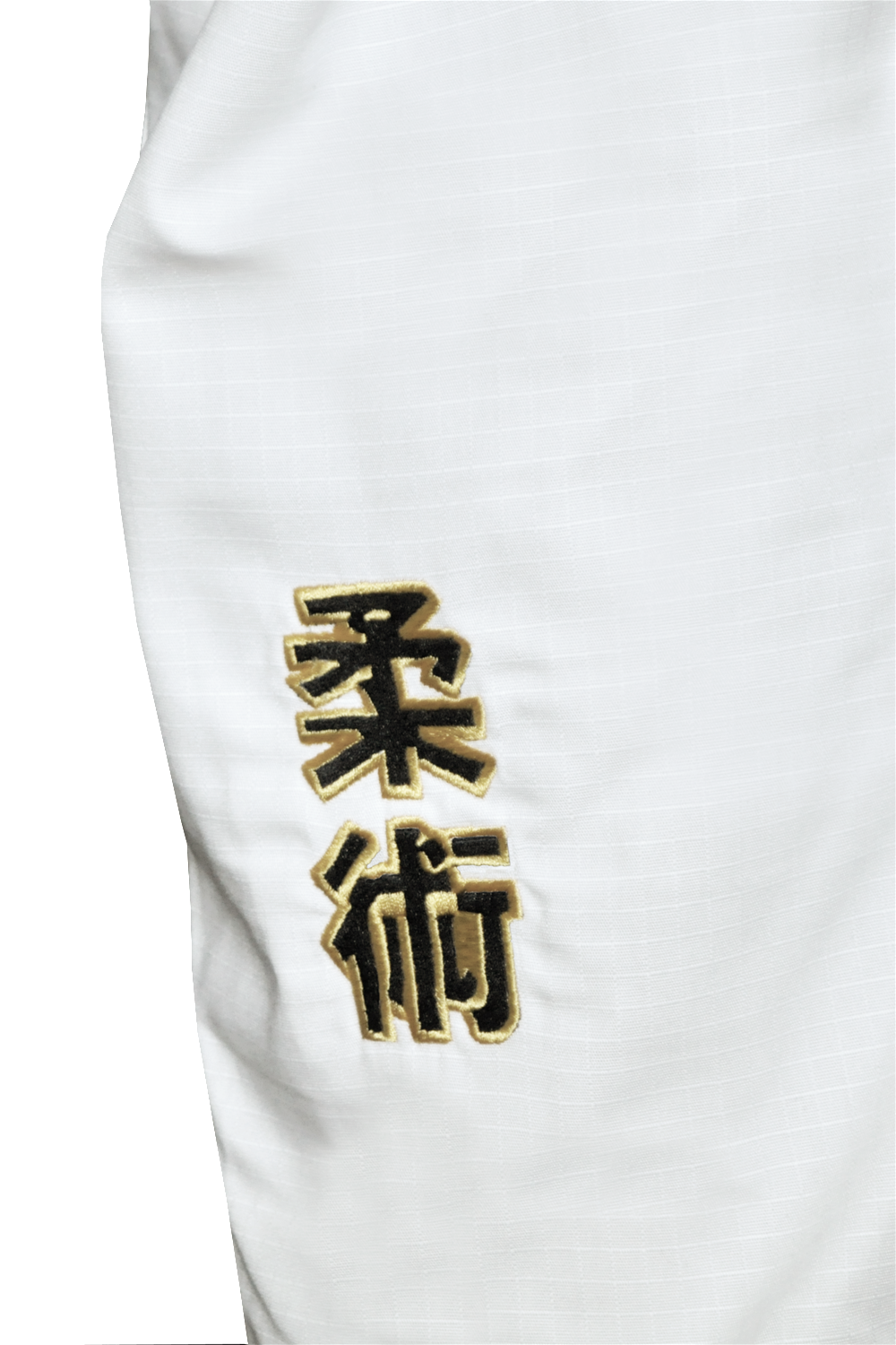 Close-up of the BJJ Revolution Super Lite Kids Gi, featuring "Jujutsu" embroidered in black and gold kanji characters on the white fabric.