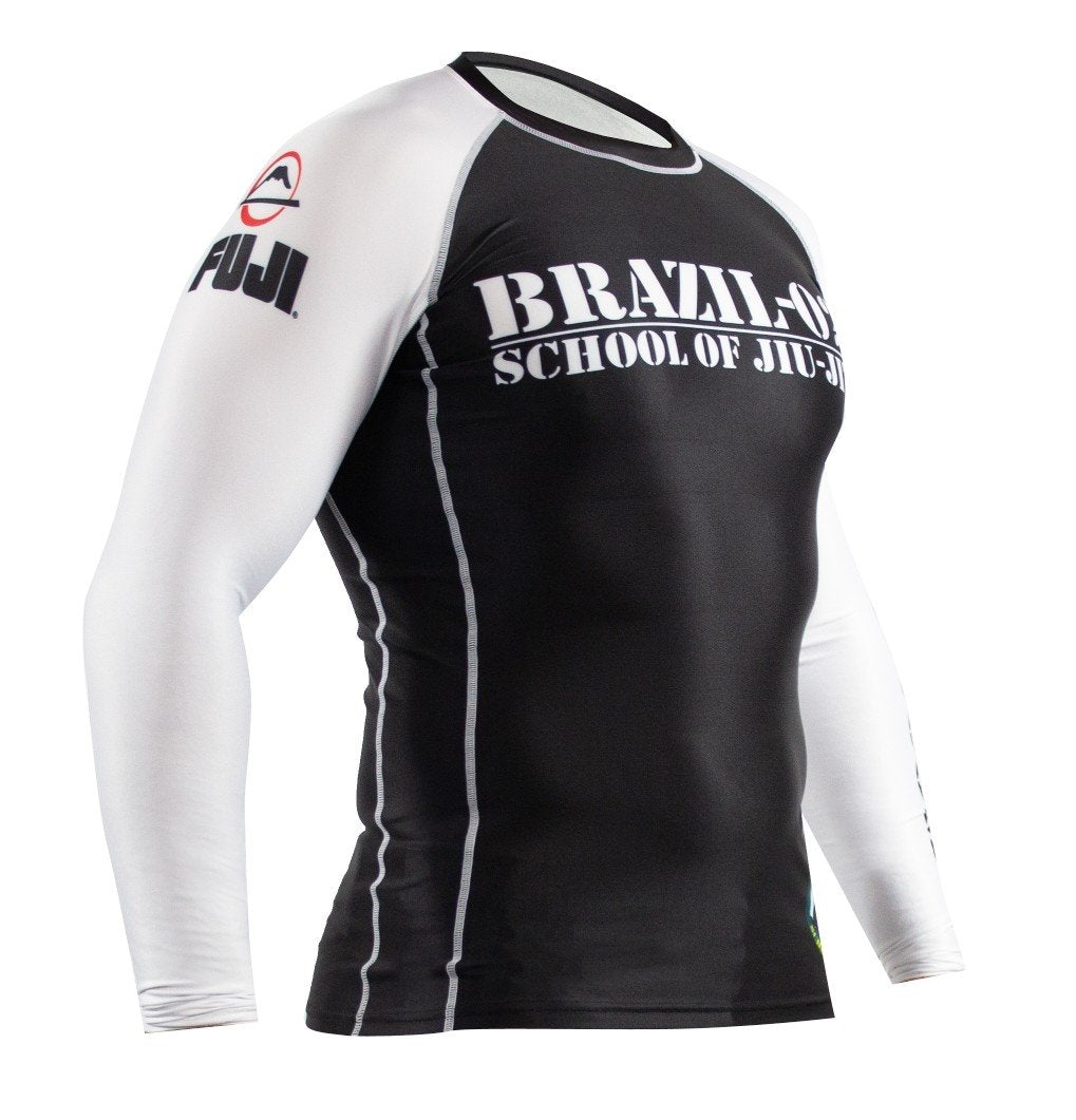 The BRAZIL 021 Ranked Rashguard is a black and white long-sleeve rash guard featuring "Brazil-021 School of Jiu-Jitsu" on the chest and "FUJI" on the left arm, shown on a plain mannequin.