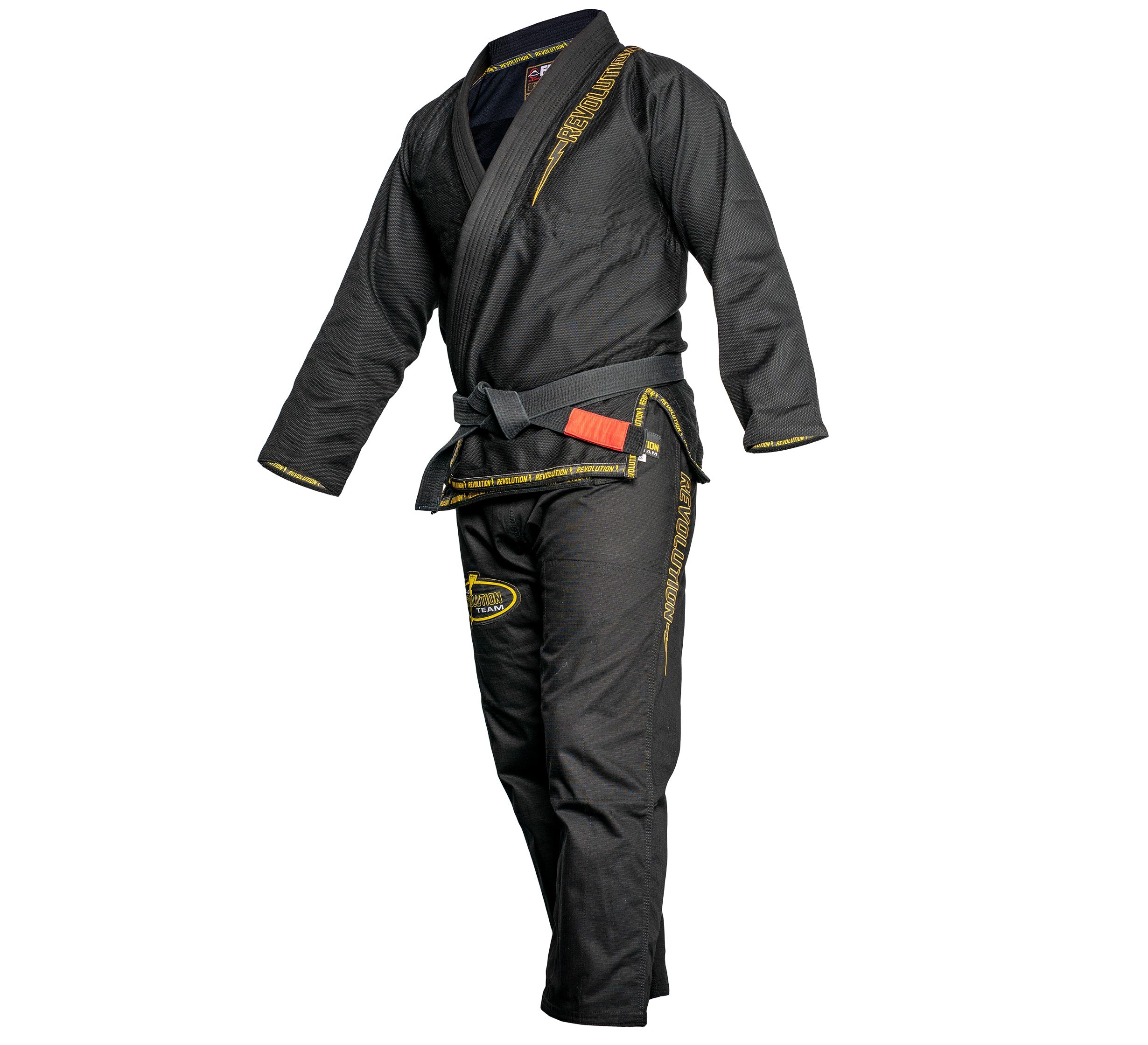 The BJJ Revolution Super Lite Kids Gi in black, shown with yellow trim and embroidery on the sleeves, pants, and belt, is displayed on a mannequin against a white background.