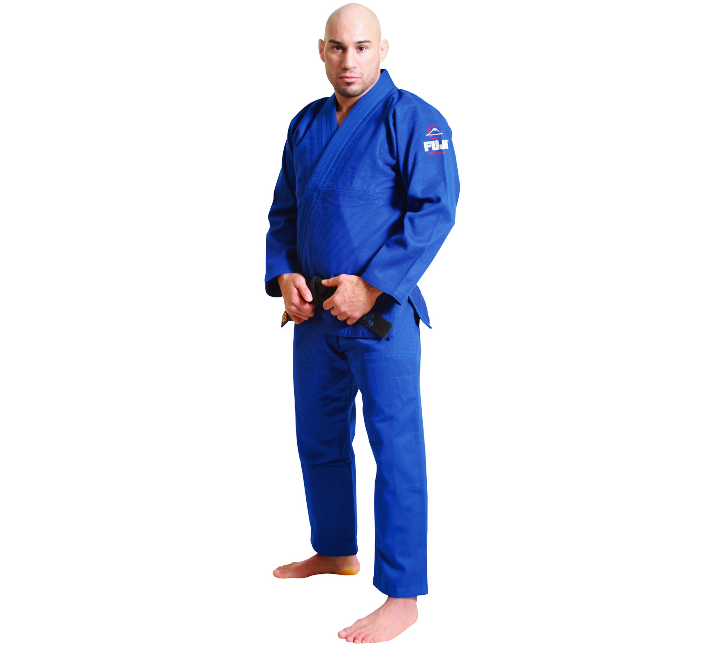 A man stands barefoot in the All Around BJJ Gi with a black belt, featuring FUJI branding on the arm. He faces forward with a neutral expression against a plain white background.