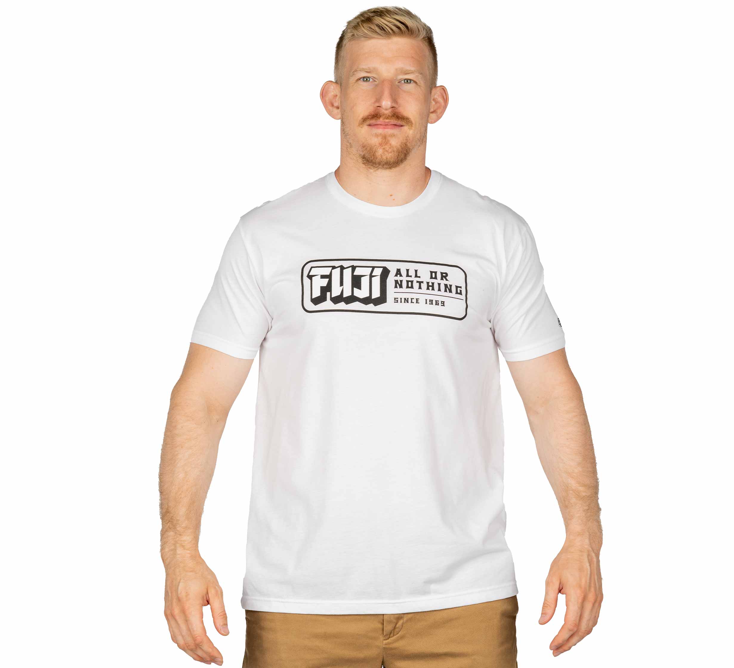 A man with short blond hair and a beard wears the Ranked Jiu-Jitsu White T-Shirt, featuring "FUJI ALL OR NOTHING SINCE 1969" in black text, while standing against a white background.