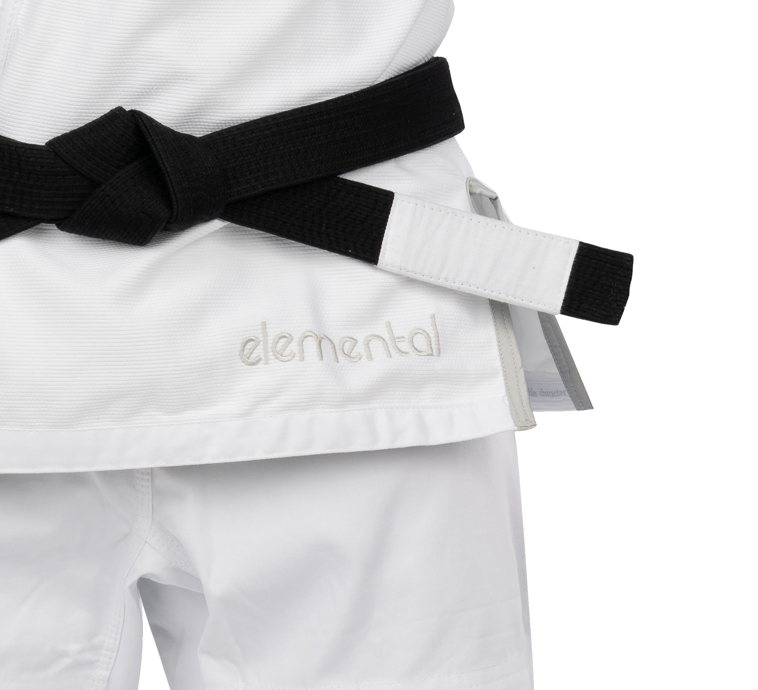 A person wearing the Elemental BJJ Gi White with "elemental" embroidered on it and a black belt tied around their waist.