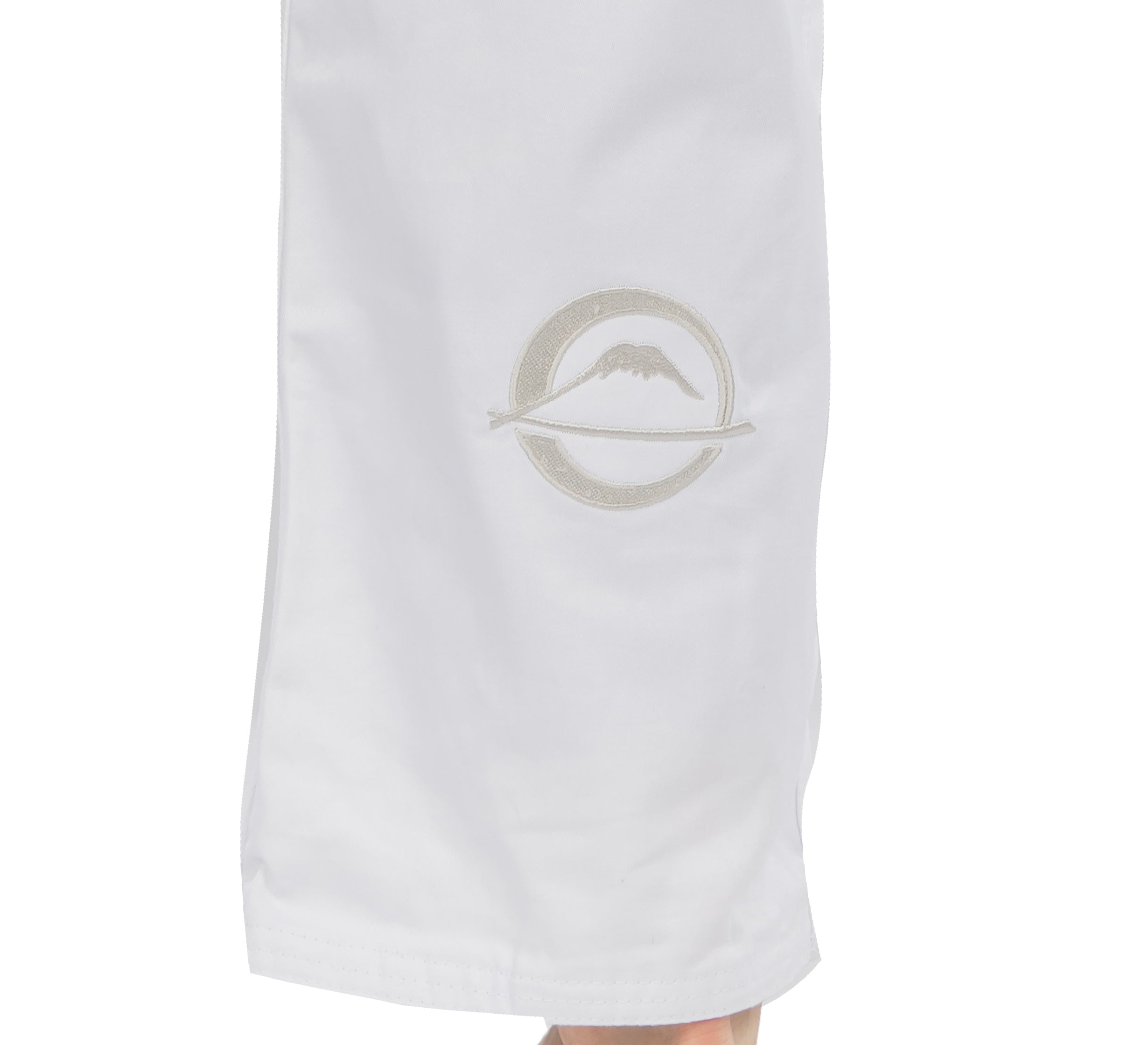 The Elemental BJJ Gi White features white fabric with a subtle embroidered logo: a mountain inside a circle crossed by a horizontal line.