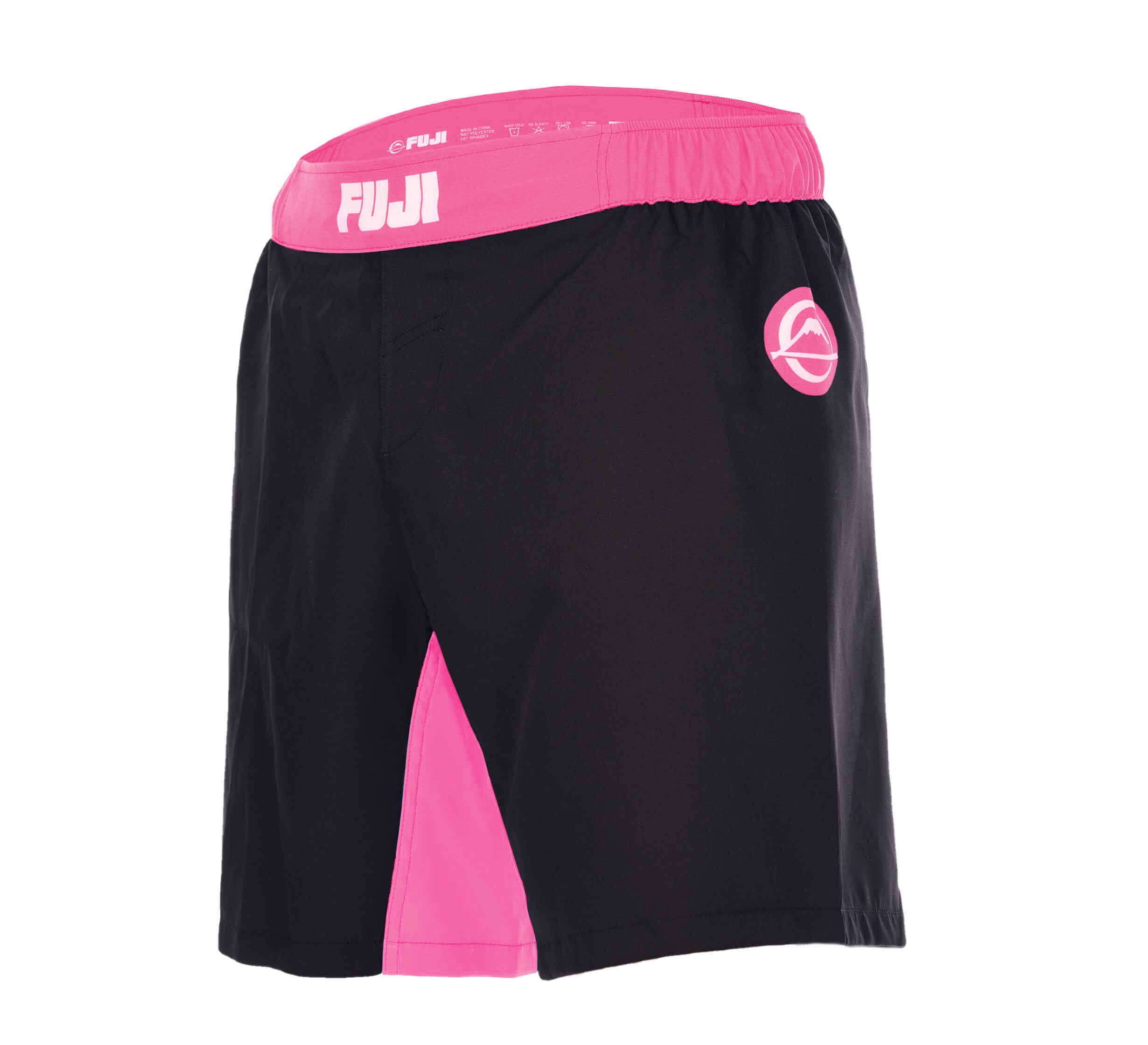 The Essential Grappling Girls Pink Fight Shorts feature a black design with a pink waistband, pink inner thigh panel, and pink logos on the waistband and left leg. Lightweight and ideal for sports or martial arts.