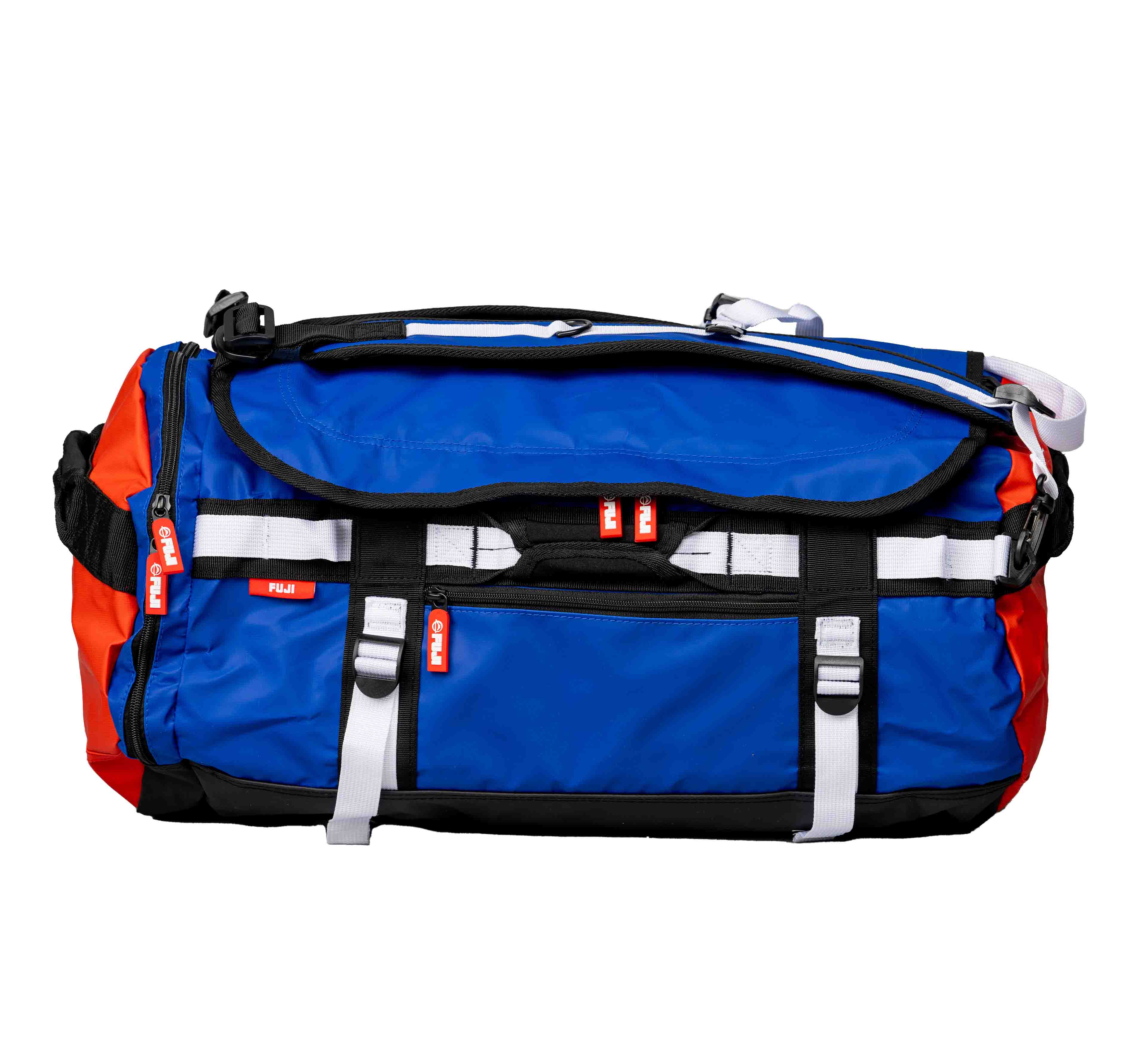 A Comp Convertible Backpack Duffle in blue, red, and black with white straps and red zipper pulls is displayed against a white background. The bag features multiple compartments and handles, offering a durable design.