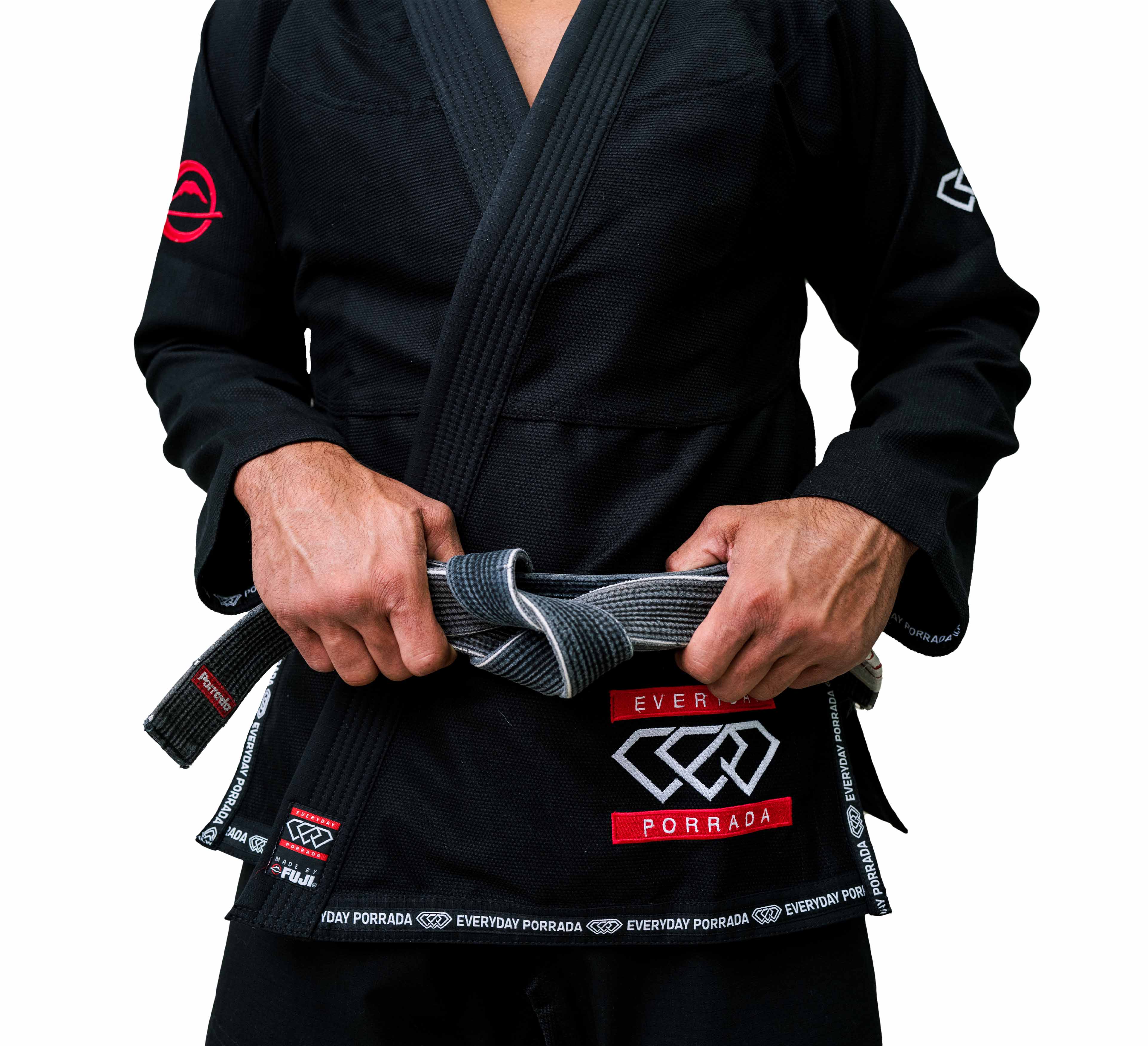 A person wears the Everyday Porrada Flow-Tech BJJ Gi—black with red and white patches labeled EVERYDAY PORRADA and various logos—while tying a gray belt; only their torso and hands are shown.