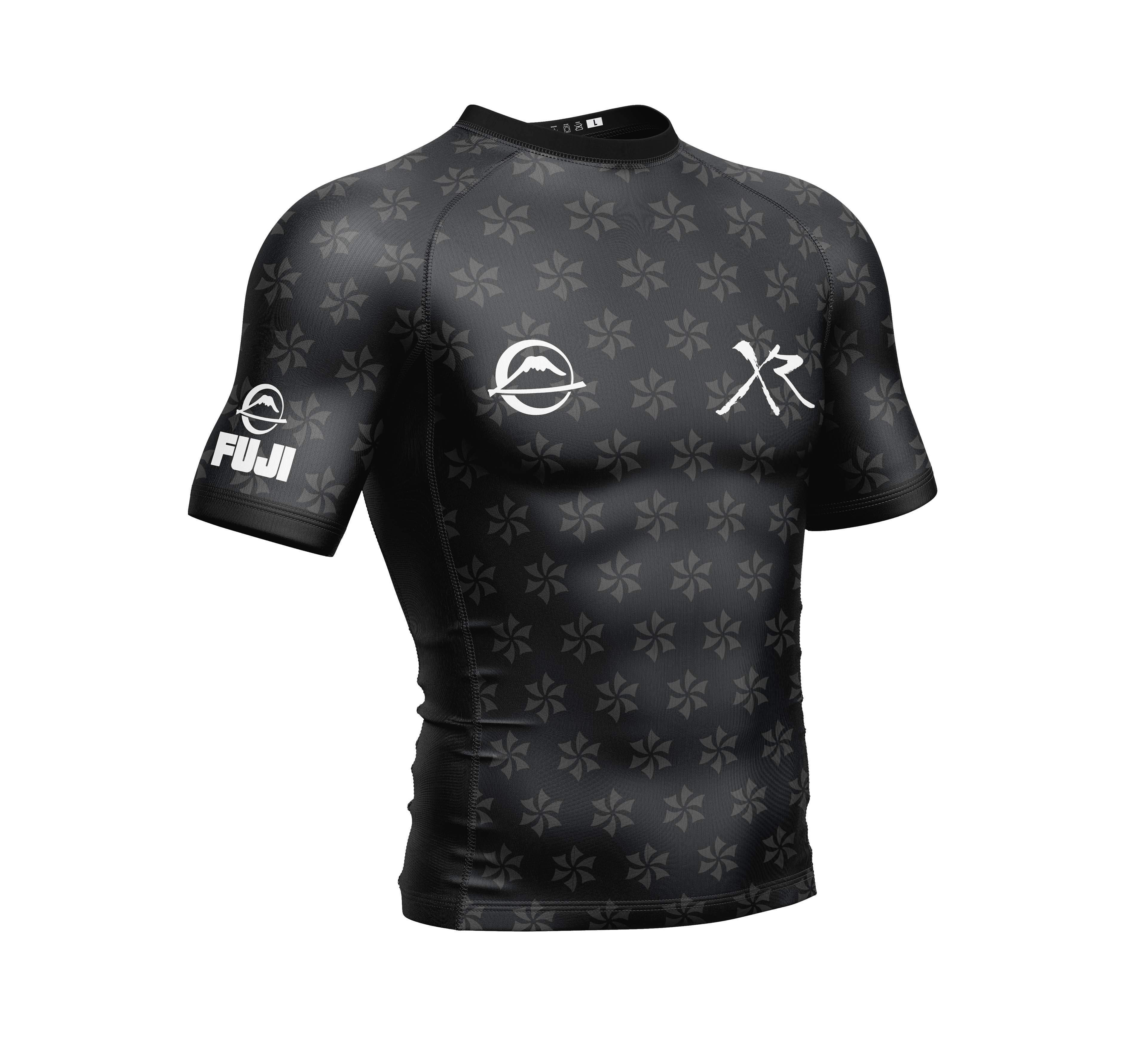 The Xande Comp Short Sleeve Rashguard Black features subtle star patterns, white chest logos, and FUJI branding on the left sleeve.