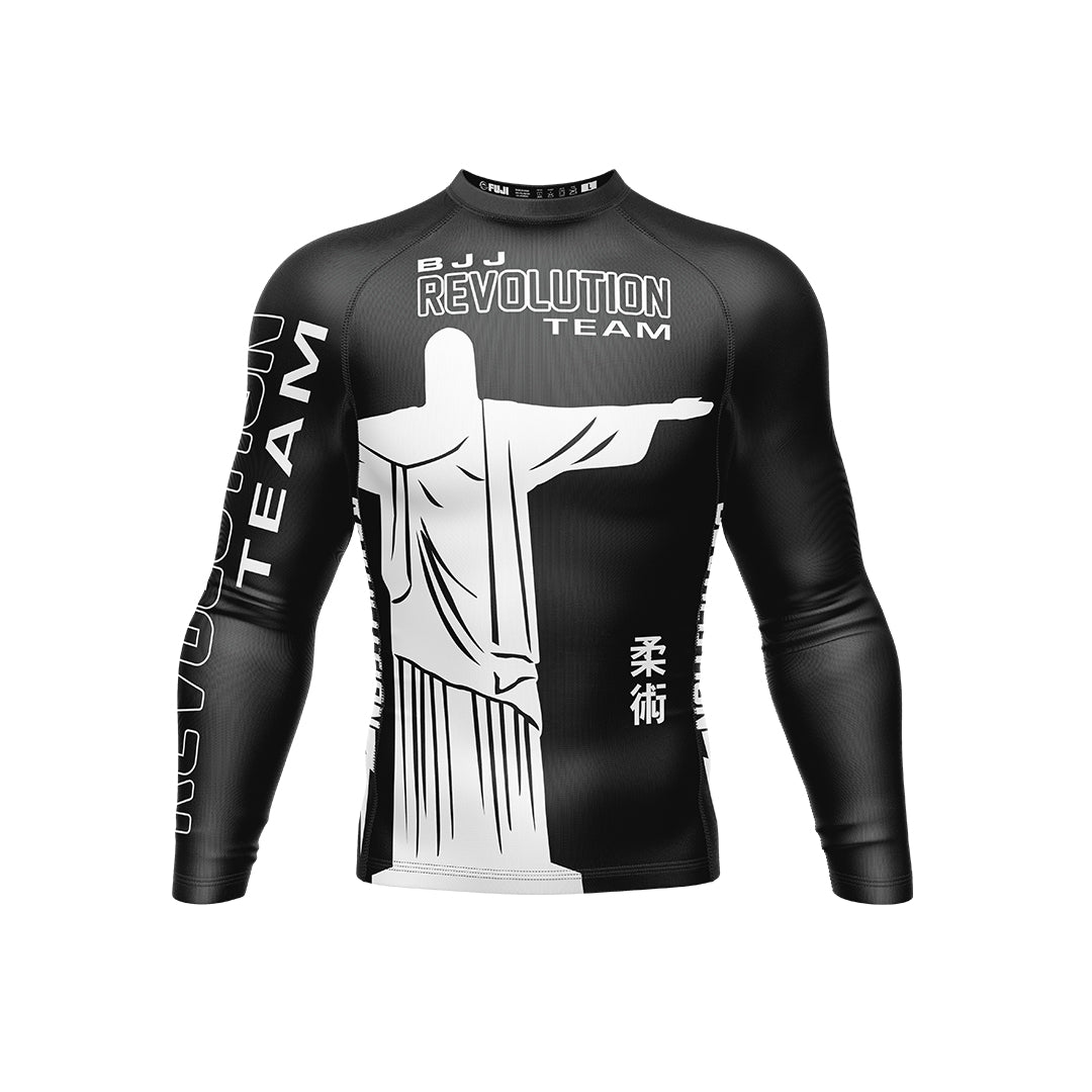 The BJJ Revolution Adult Ranked Long Sleeve Rashguard in black features white graphics of the Christ the Redeemer statue, "BJJ Revolution Team" text, and Japanese kanji on the chest and sides.