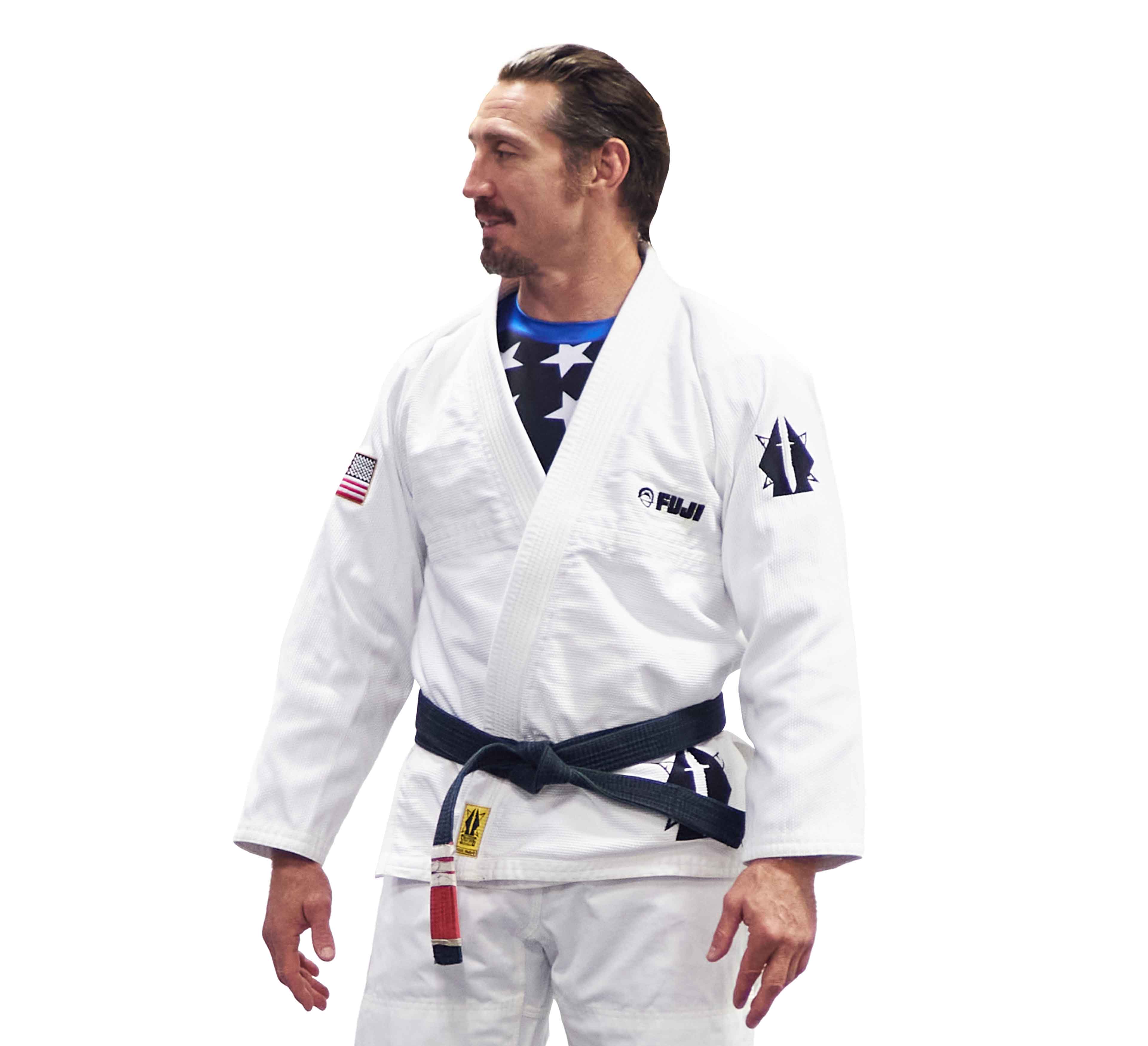 A man wearing the Lightweight BJJ Gi Sheepdog Response Edition in white.