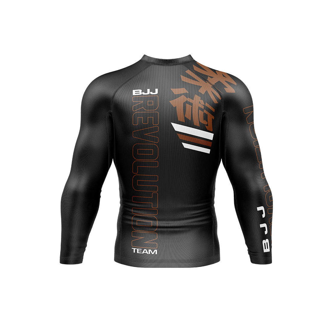 The BJJ Revolution Adult Ranked Long Sleeve Rashguard is black with bold orange "REVOLUTION" and "BJJ" on the back and sleeve, white stripes, and orange Japanese kanji on the upper back.