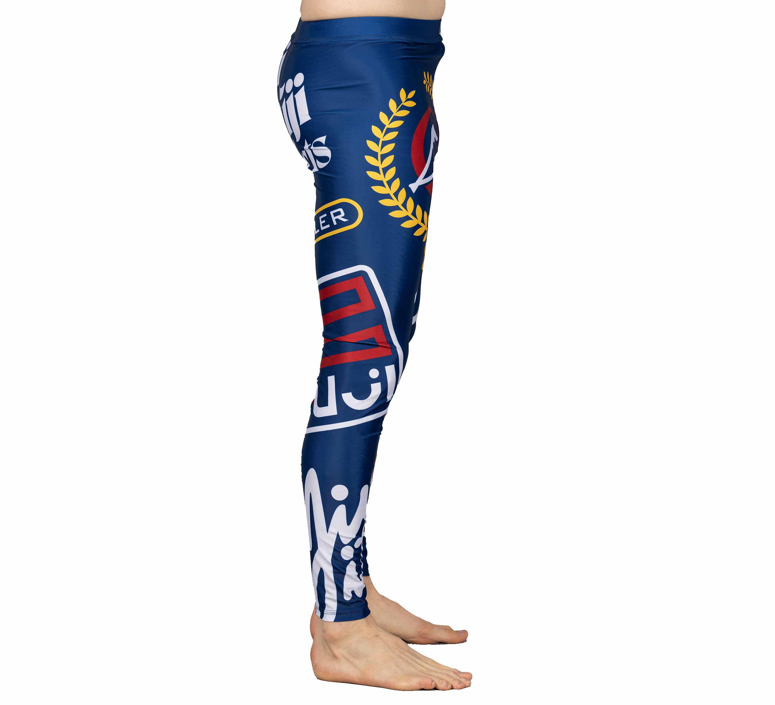 A person stands sideways, barefoot, against a white background wearing XTR Extreme V1 Grappling Spats Navy featuring vibrant graphic designs and Arabic text.