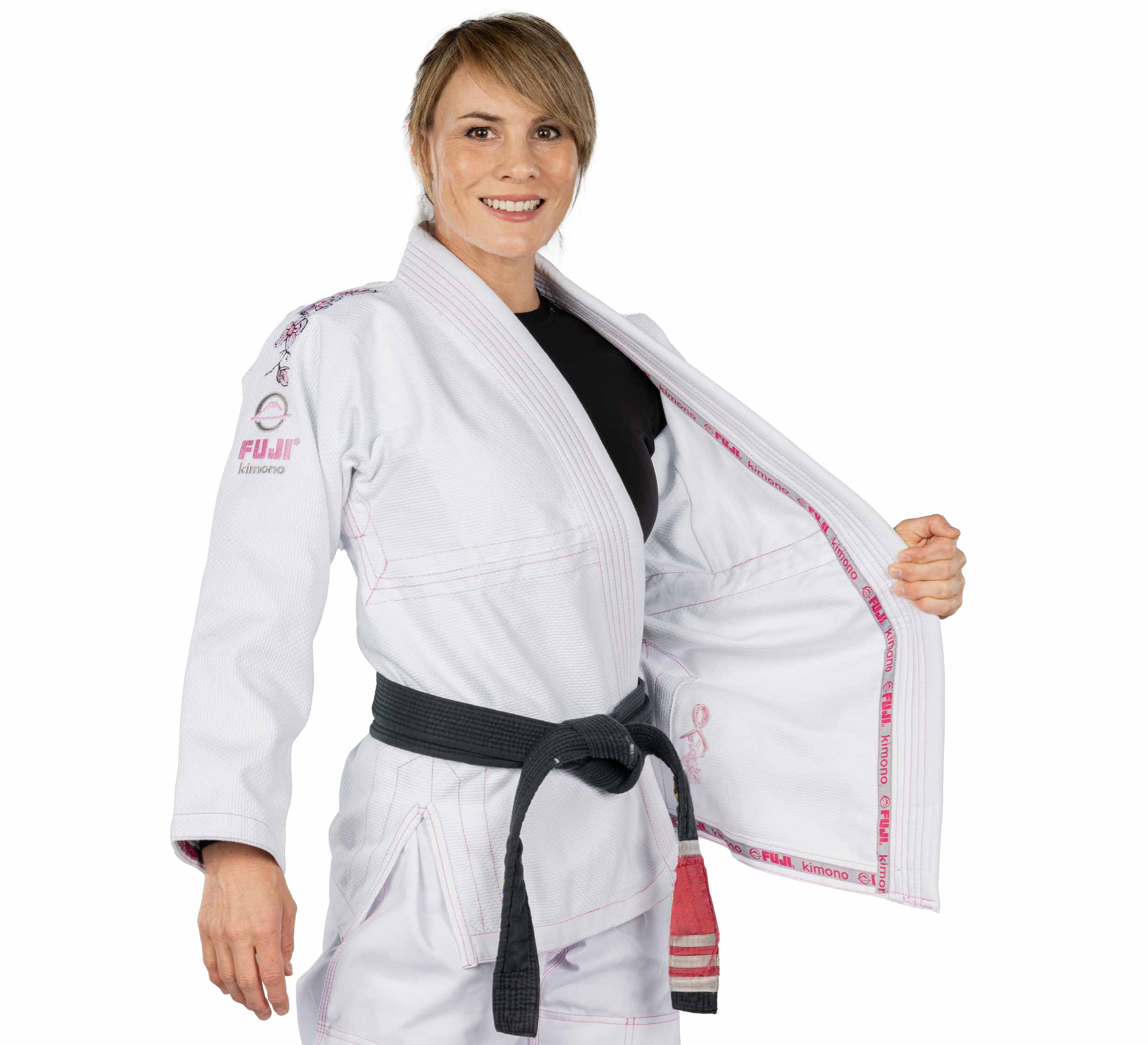 A woman wearing the Blossom Womens Jiu Jitsu Gi in white.