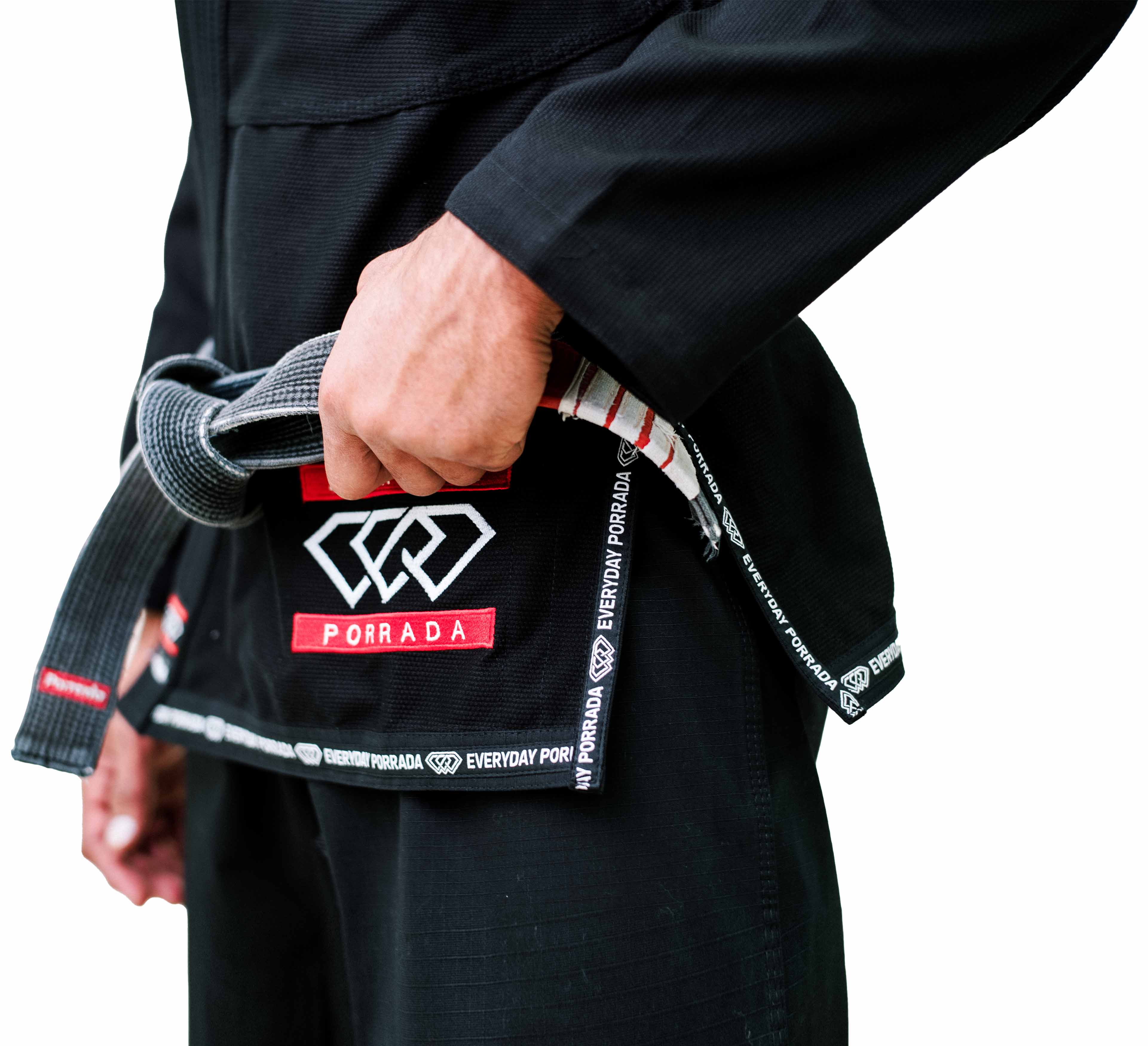 A person wearing the Everyday Porrada Flow-Tech BJJ Gi with Porrada and Everyday Porrada patches ties a black belt around their waist.